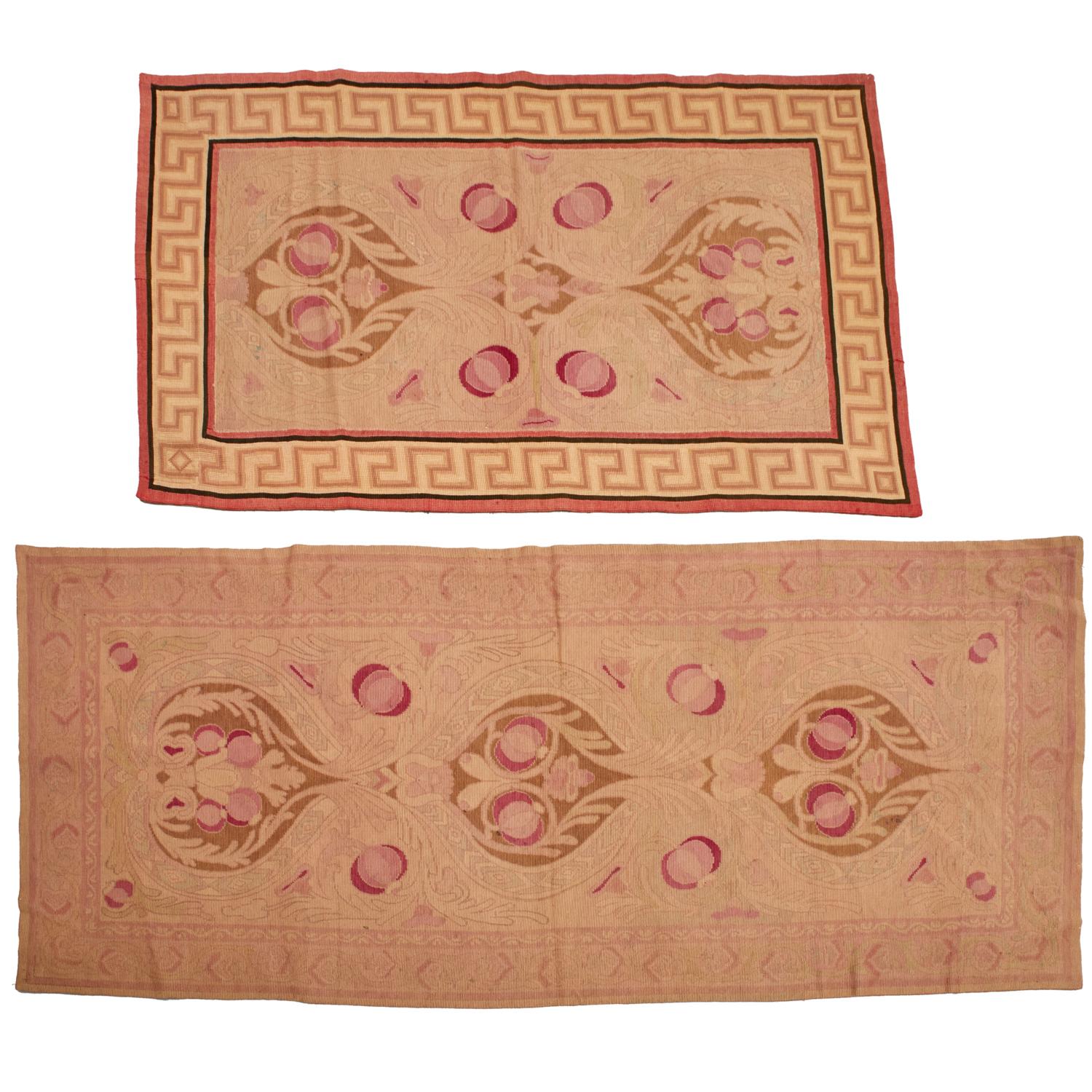 An evocative pair of early 20th-century Art Nouveau area rugs, likely of Viennese origin, each featuring a stylized floral design inspired by the Vienna Secession. Executed in a flatwoven tapestry technique with cotton backing, the rugs display