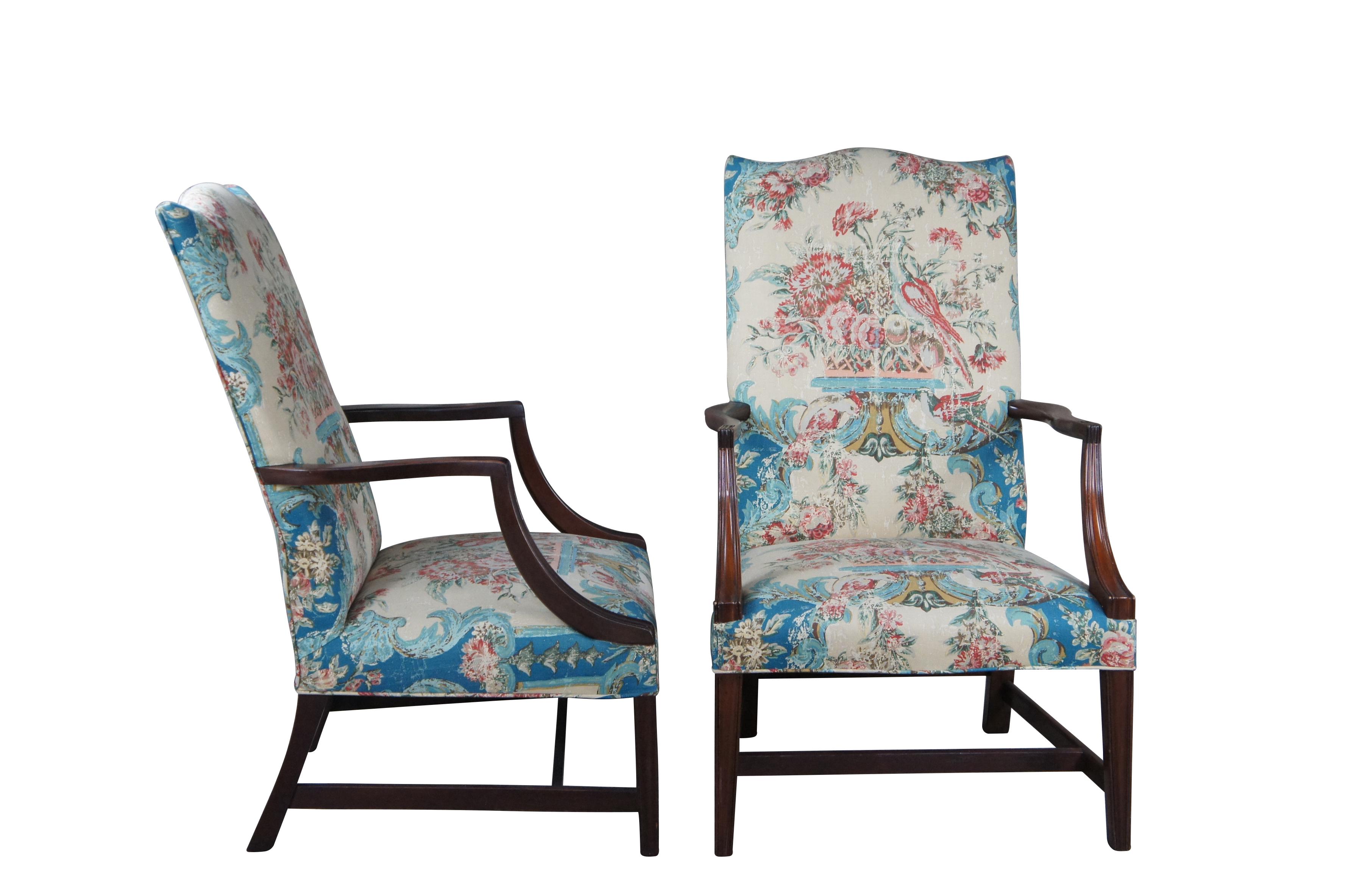 Pair of 20th Century Federal Style Martha Washington Lolling armchairs.  Reminiscent of the Gainsborough chair that was made in England in the 18th century.  Made of mahogany featuring traditional wide form with serpentine high back and open