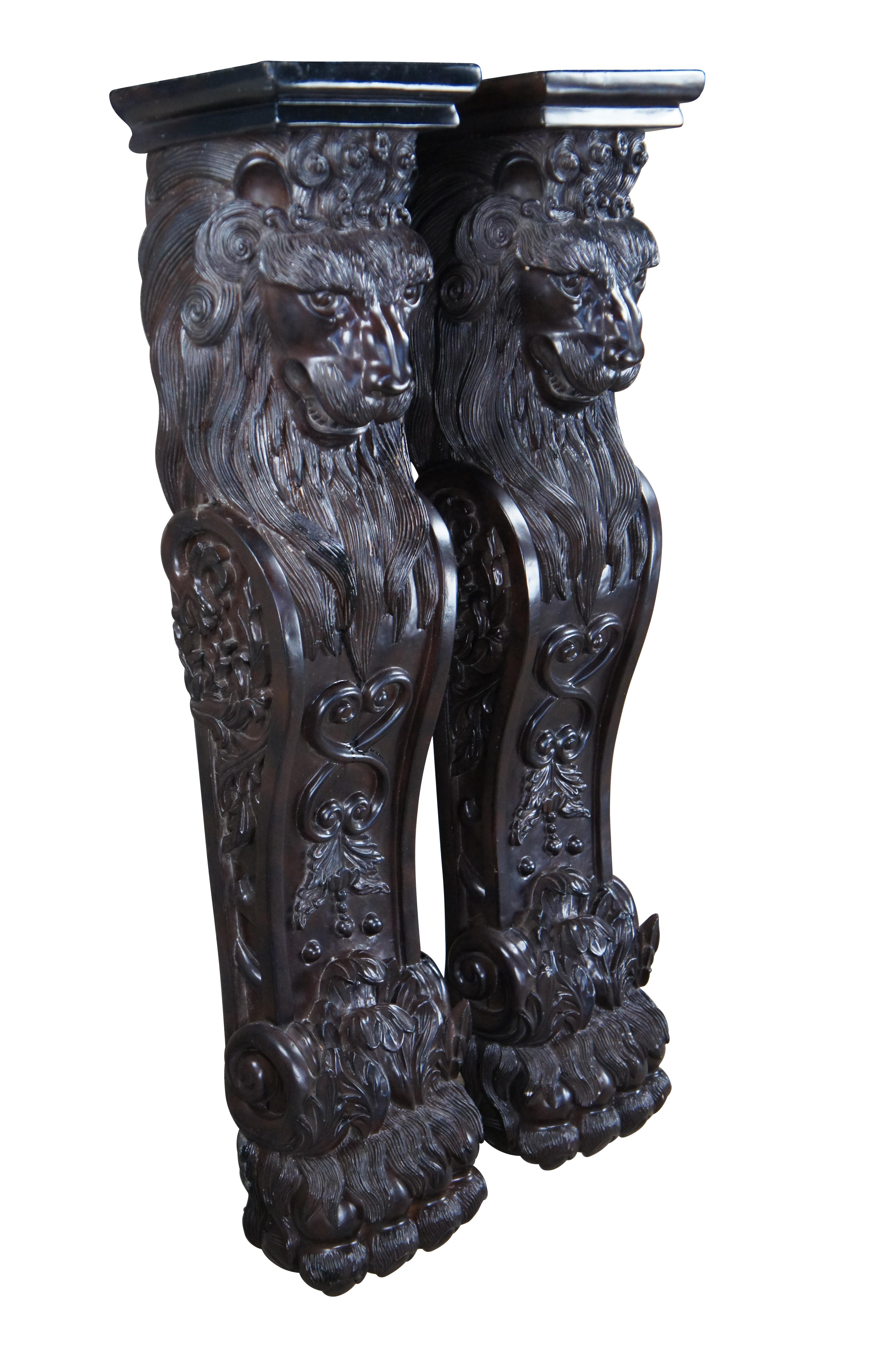 Pair of two vintage Raymond Enkeboll style columns / corbels / pillars / stands.  Made of composite featuring ornate lion heads, acanthus designs, and hairy paw / claw feet. 

Dimensions:
10.5