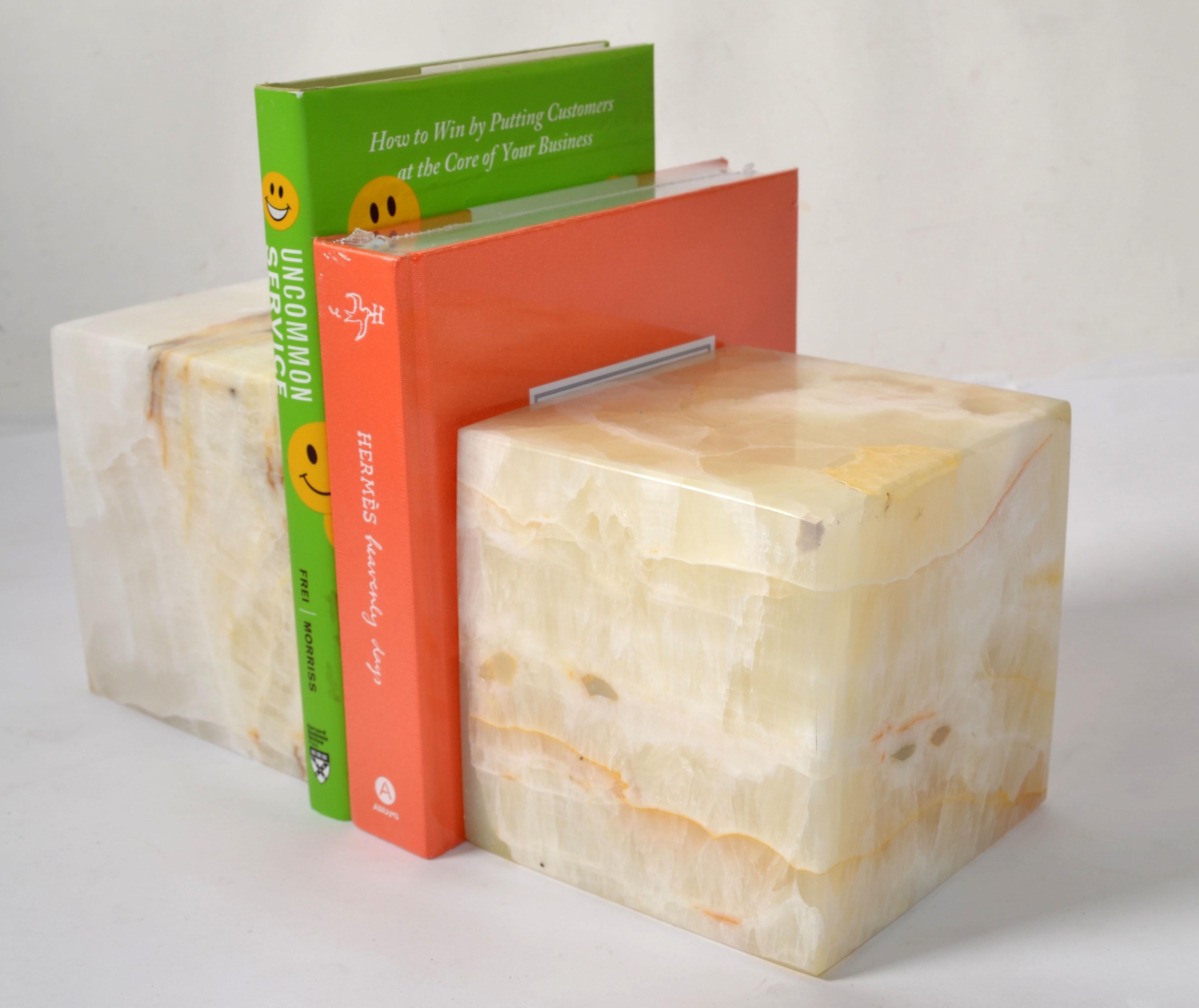 Pair of hand carved Italian Tan, Taupe, Beige Cube Onyx bookends in the Style of Lella & Massimo Vignelli. These are very substantial, heavy and well handmade bookends. They are handmade in warm natural earth colors of the Onyx Marble. 
This set is