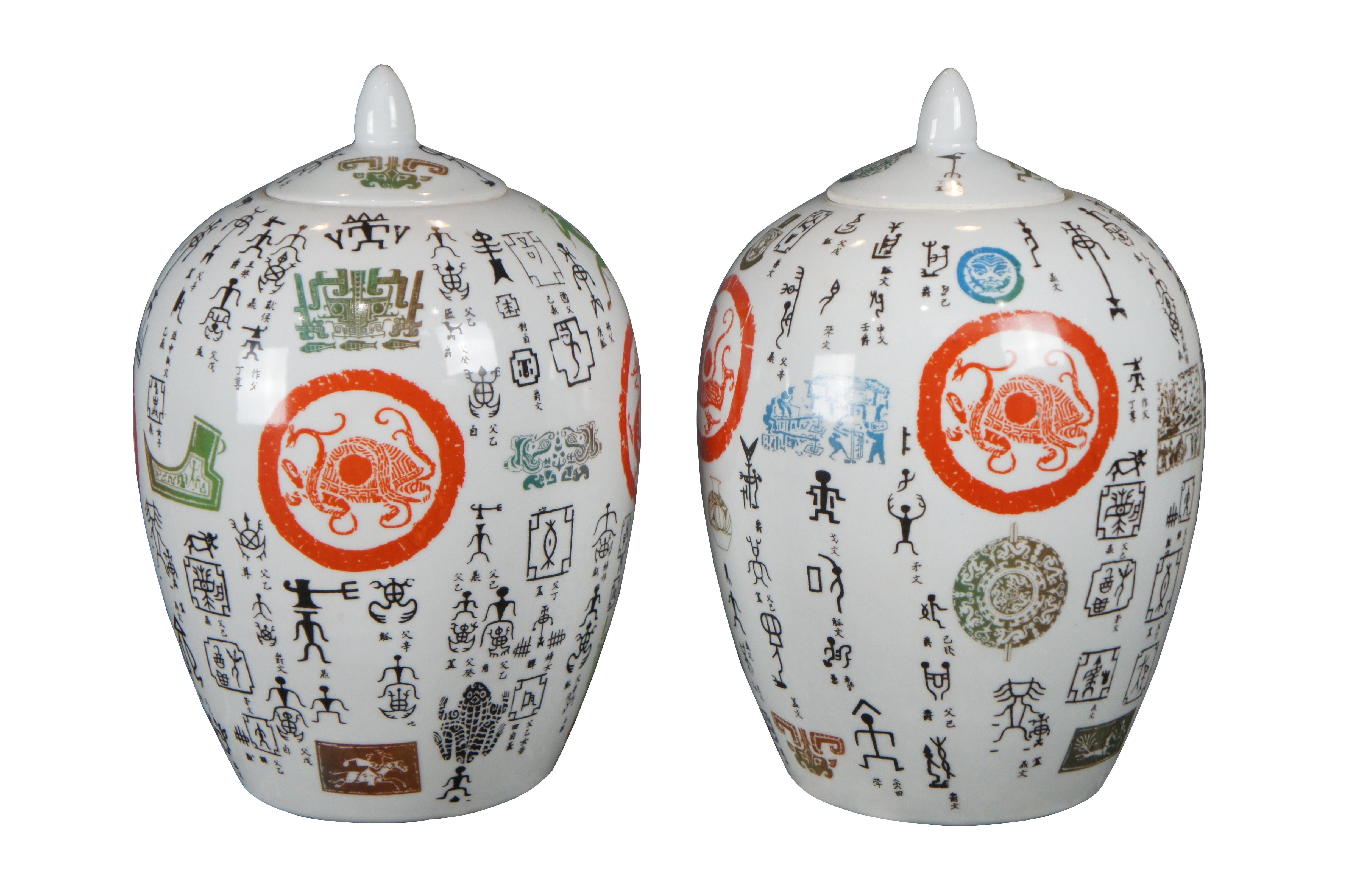 Pair of Chinese Famille Rose ginger jars. Made from porcelain with a uniquely finished exterior featuring animals and figures. The urn has a unique melting pot vibe drawing together motifs from Mesoamerica and Egypt.

Dimensions:
8.5