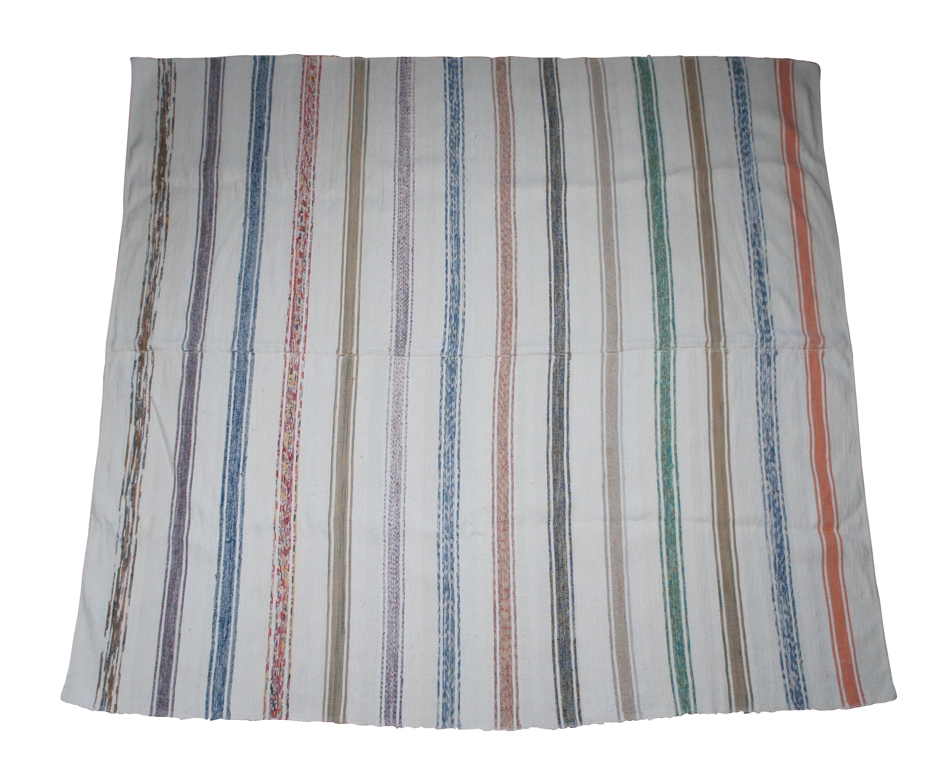 Pair of vintage hand loomed blankets or floor coverings.  Features a striped cotton pattern.

Dimensions:
White Stripe - 72
