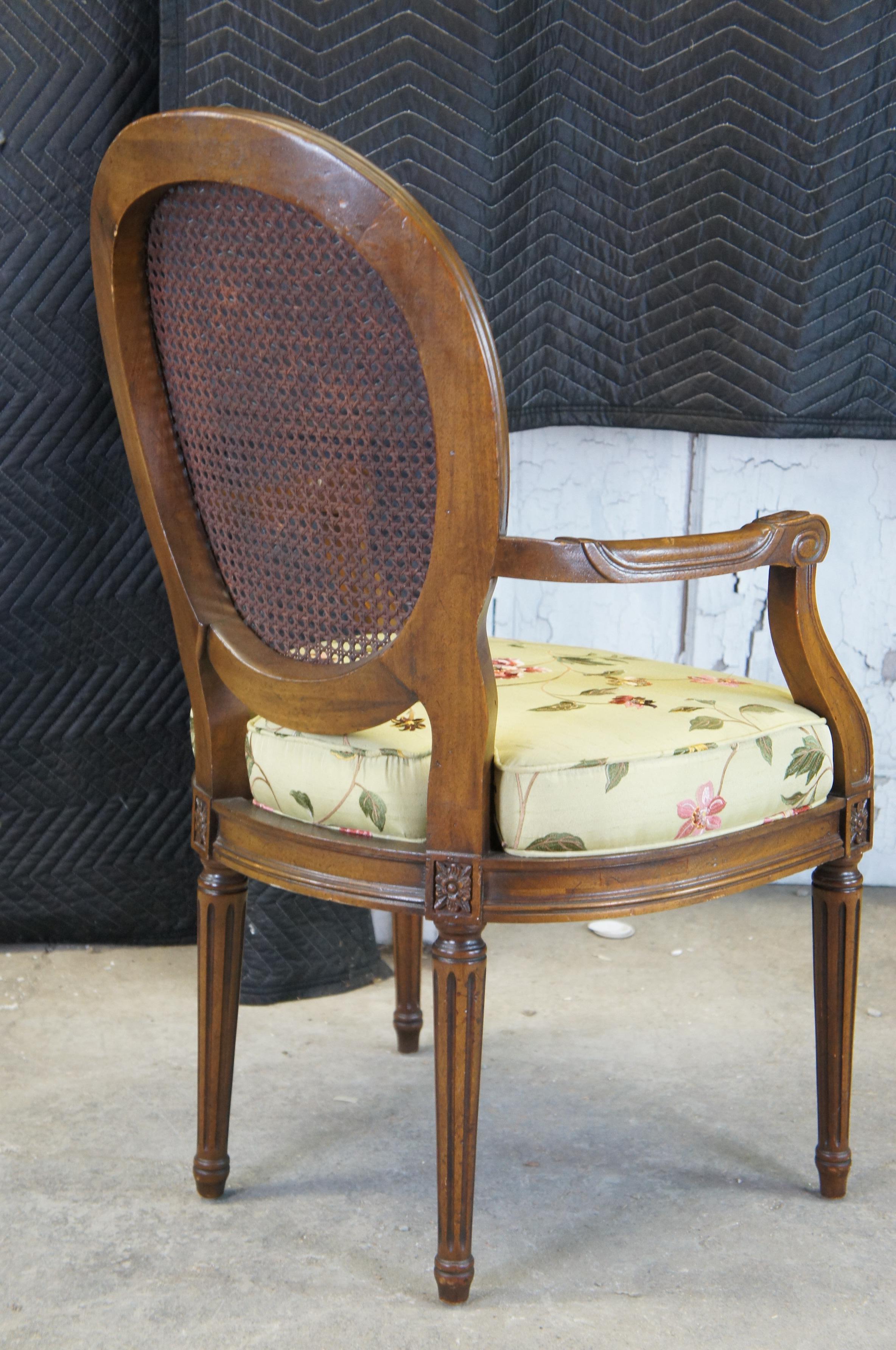 20th Century 2 Vintage French Louis XVI Caned Walnut Open Arm Oval Balloon Back Arm Chairs