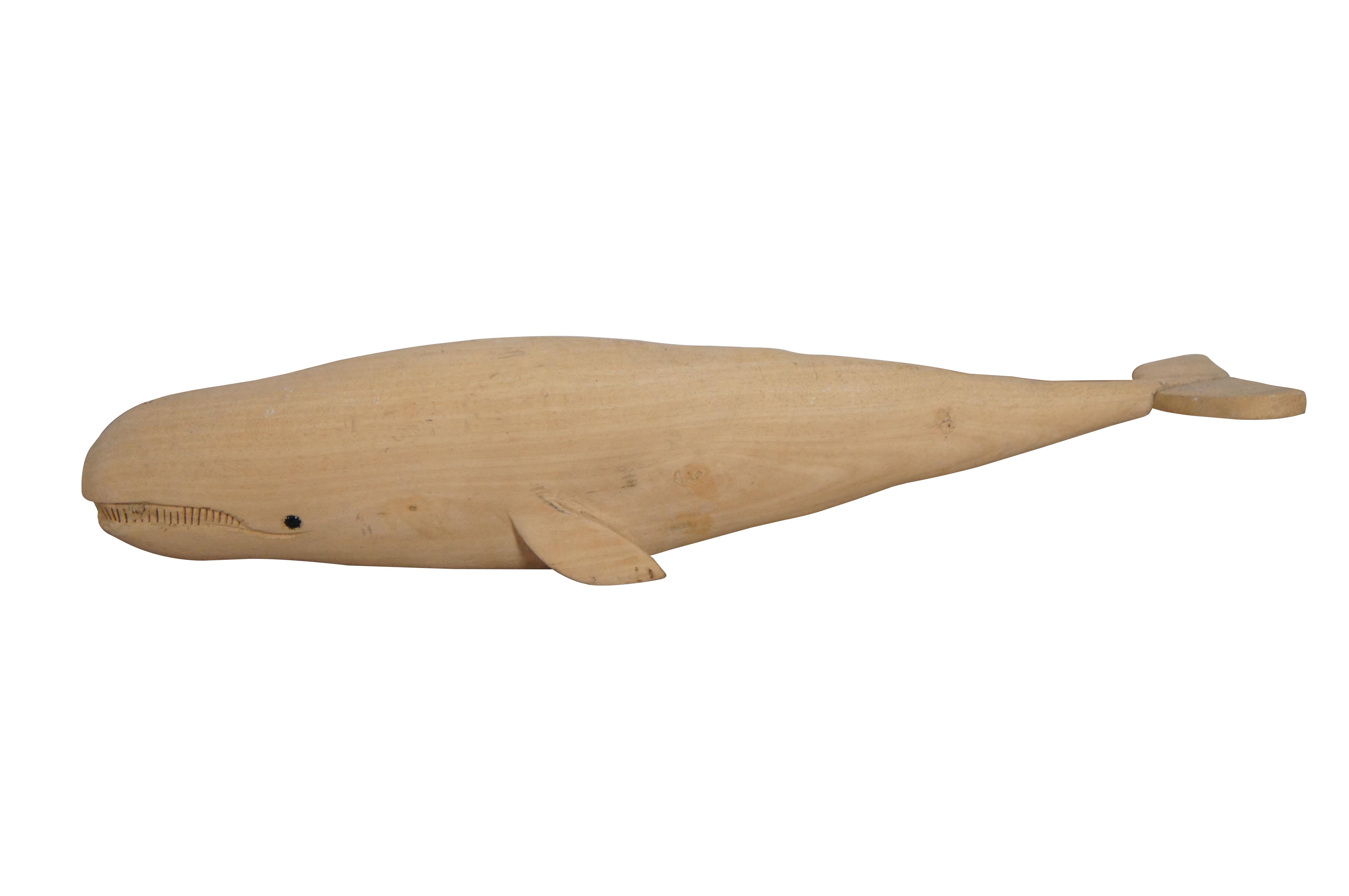 Pair of mid to late 20th century hand carved teak wood whale figurines - one sperm whale with inlaid eyes and one humpback whale perched on a small burl.

Dimensions:
Sperm Whale - 14
