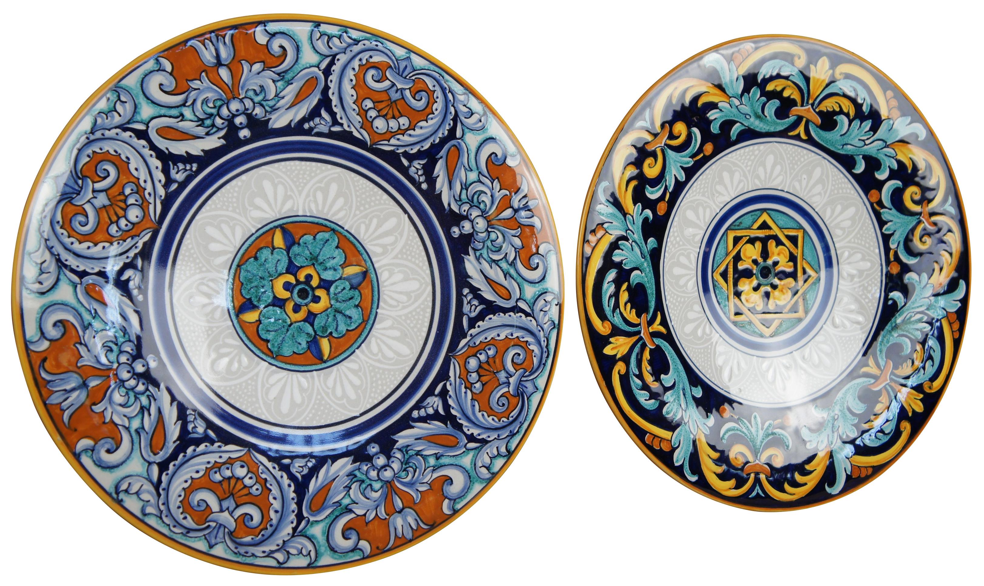 Two ceramic Francesca plates made in Deruta Italy for Cottura pottery with colorful geometric patterns both with wire for hanging.
Measure: 12