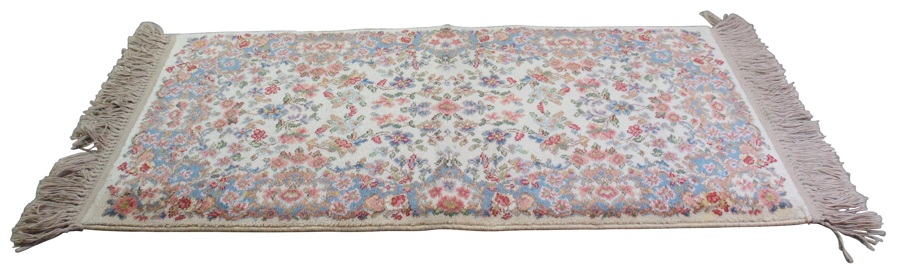 Two vintage Karastan mats in the Ivory Kirman 788 pattern. Measures: 2' x 4'.