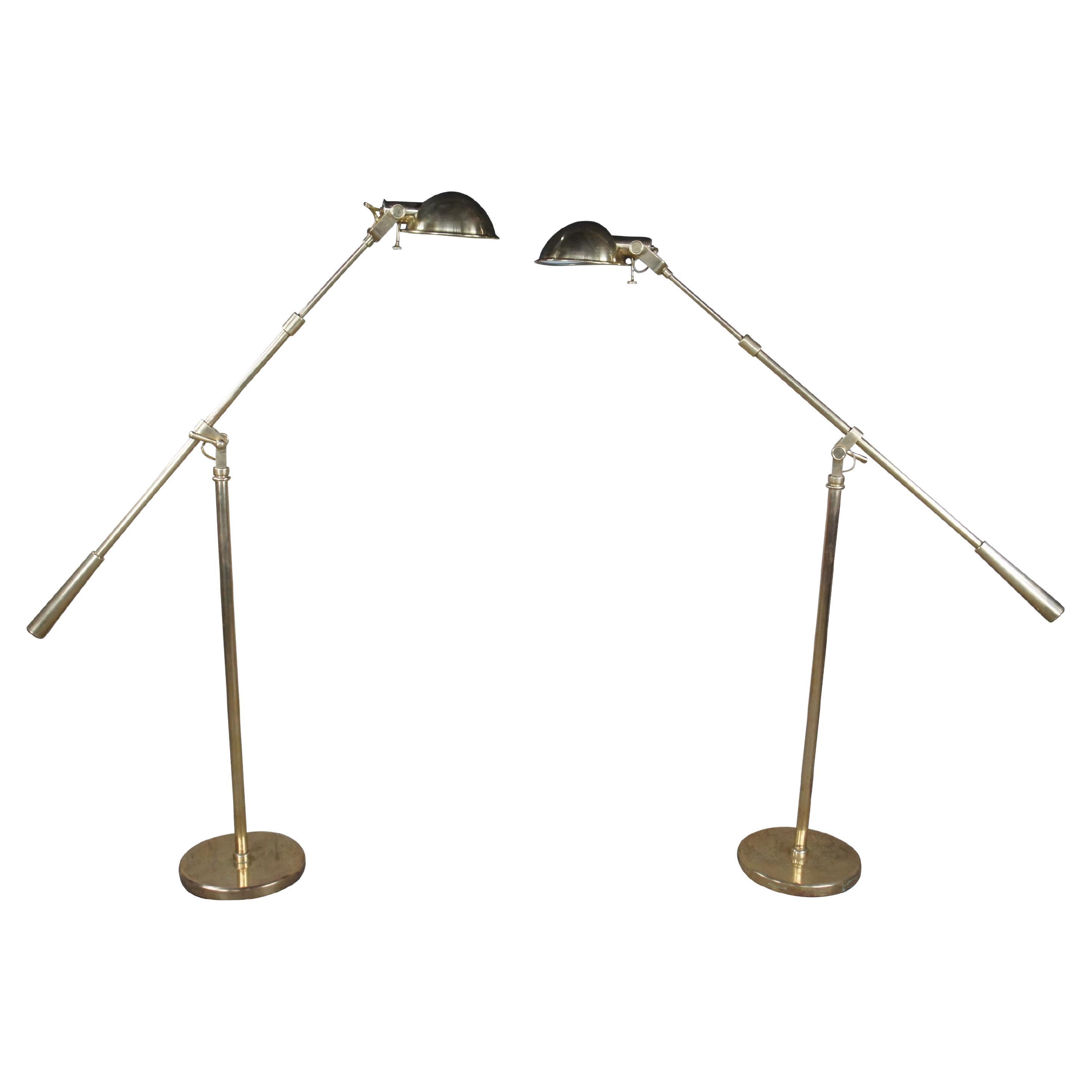 Pair of Ralph Lauren Home Boom Arm Pharmacy Lamps, circa 1990s. The design is based on early twentieth-century work lamps and includes knobs inspired by an antique watch. Exposed wire is reminiscent of antique lighting. Height is