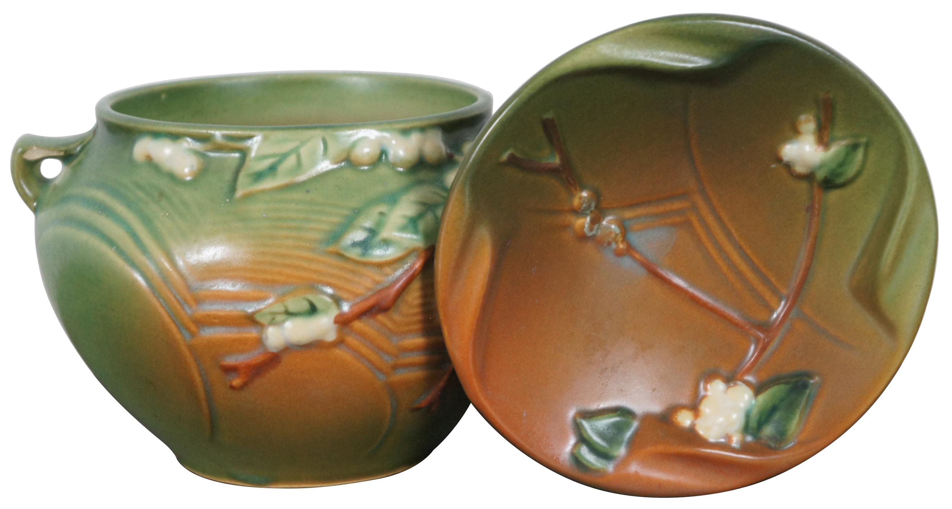 Vintage Roseville Pottery number IJ-4 green and brown Snowberry double handled vase and dish.

Planter - 6.25” x 5.75” x 4.125” / Plate - 5.25” x 1.125” (Width x Depth x Height/Diameter x Height).