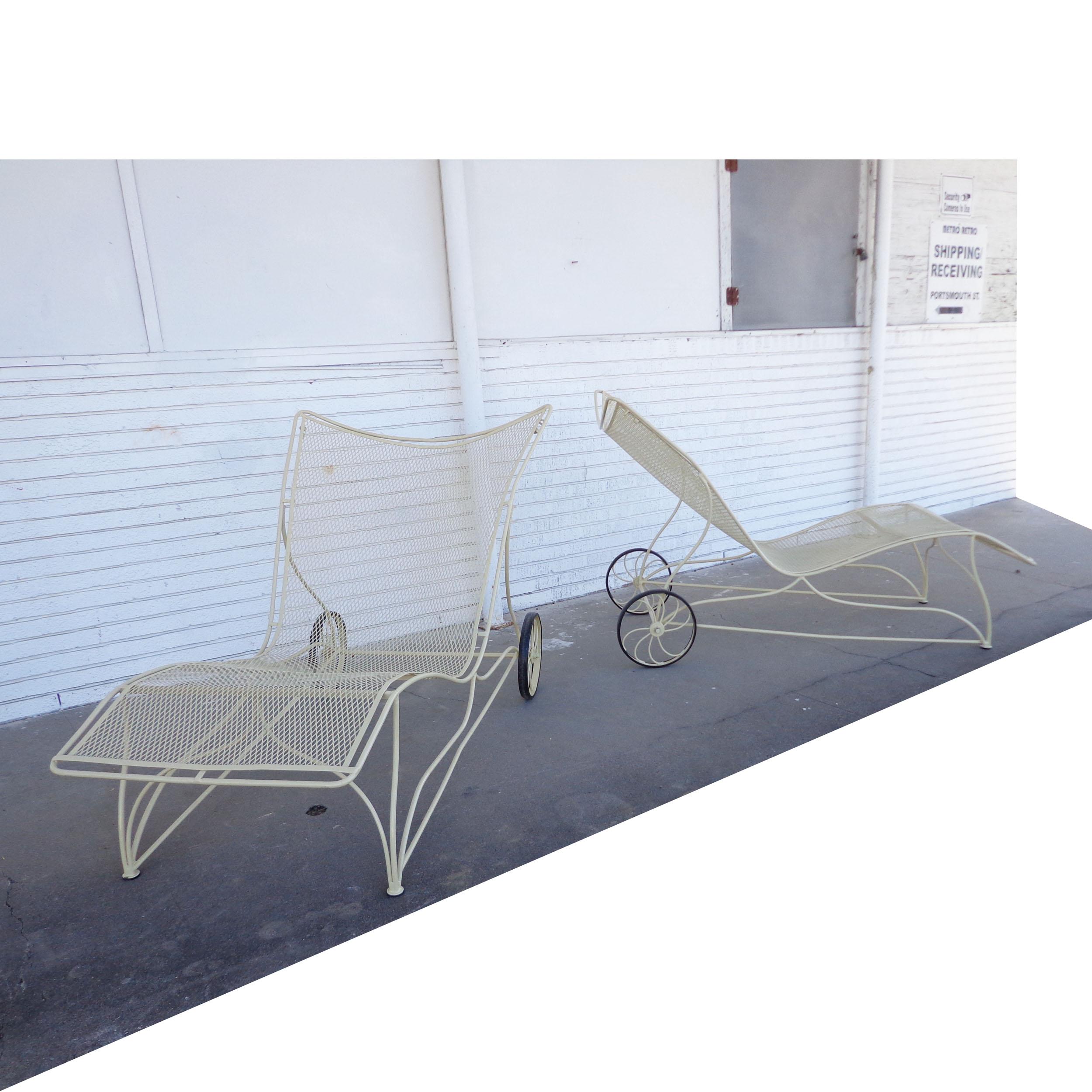 2 Vintage Russell Woodard patio chaises

Rare pair of oversized wrought iron chaise lounges featuring wide frames and wheels. Recently restored in rich buttercream. 
Measurements: 40.5