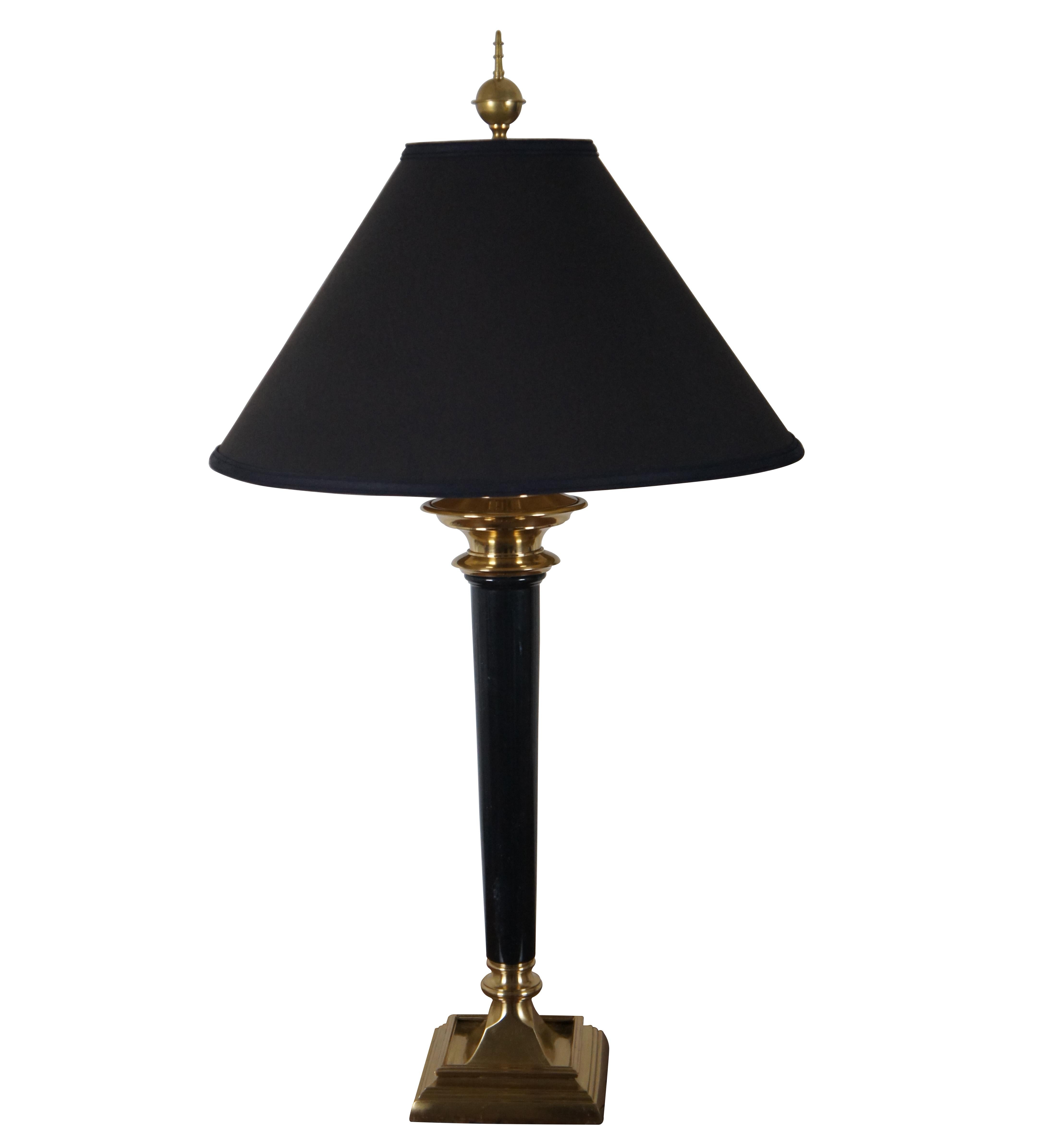 Pair of vintage American Empire or Regency style brass and black marble torch shaped table lamps by Speer Collectibles with spindle shaped finial and black shades with gilded interiors.

Measures: 6.5 x 6.5 x 26 / Shade - 20 x 10.25 / Total Height