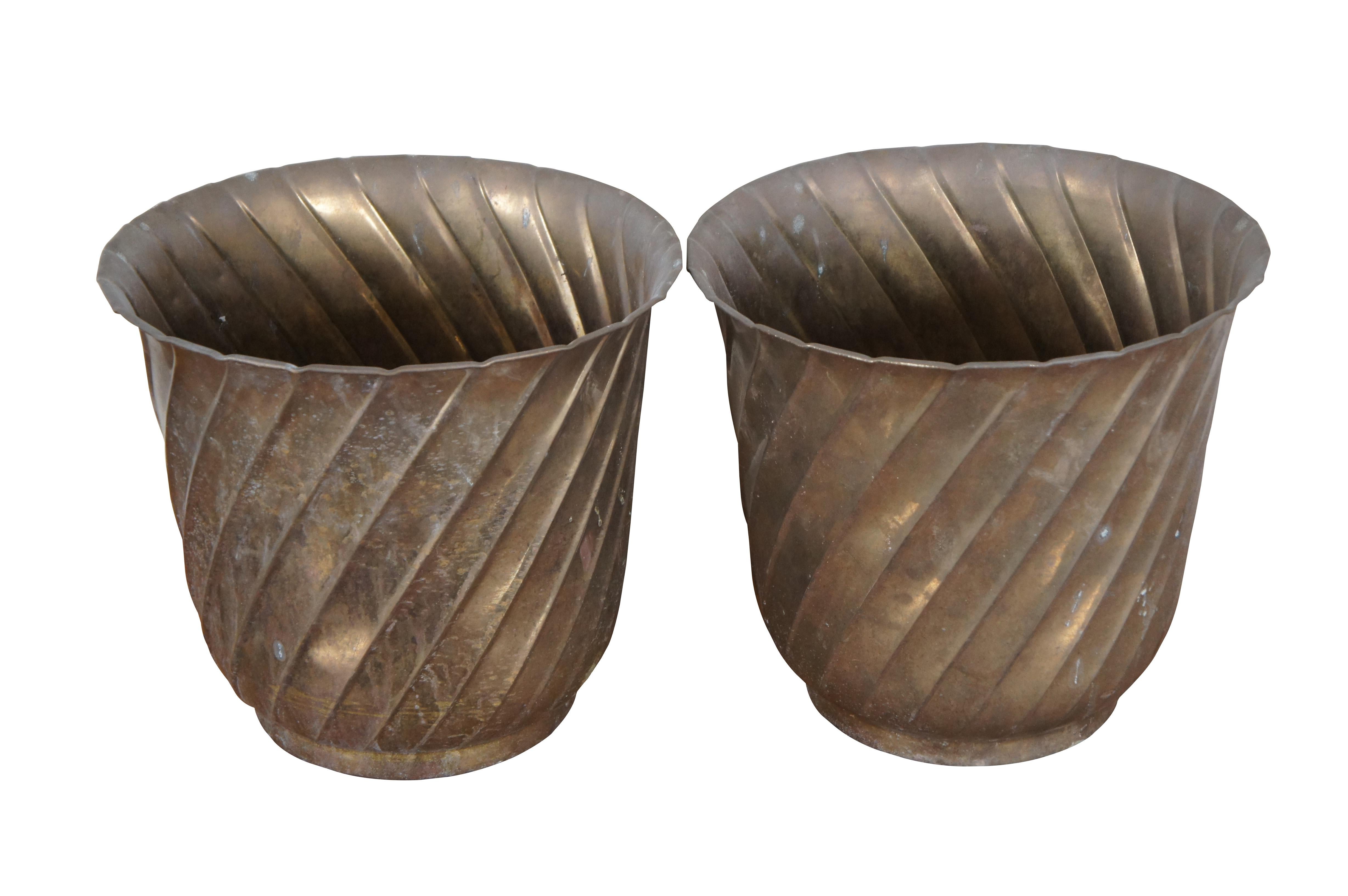 Two vintage brass planters / cachepots or garbage / trash cans featuring spiral design with flared rim.  Made in India.

Dimensions:
12