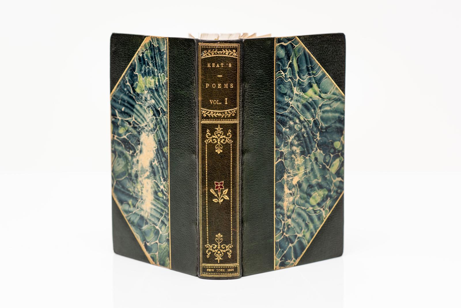 2 Volumes. John Keats, The Poems of John Keats, edited by George Thorn Drury with an introduction by Robert Bridges. Bound in 3/4 green morocco with marbled boards. Gilt-tooling on covers and raised band spines. Top edge gilt. Marbled endpapers.