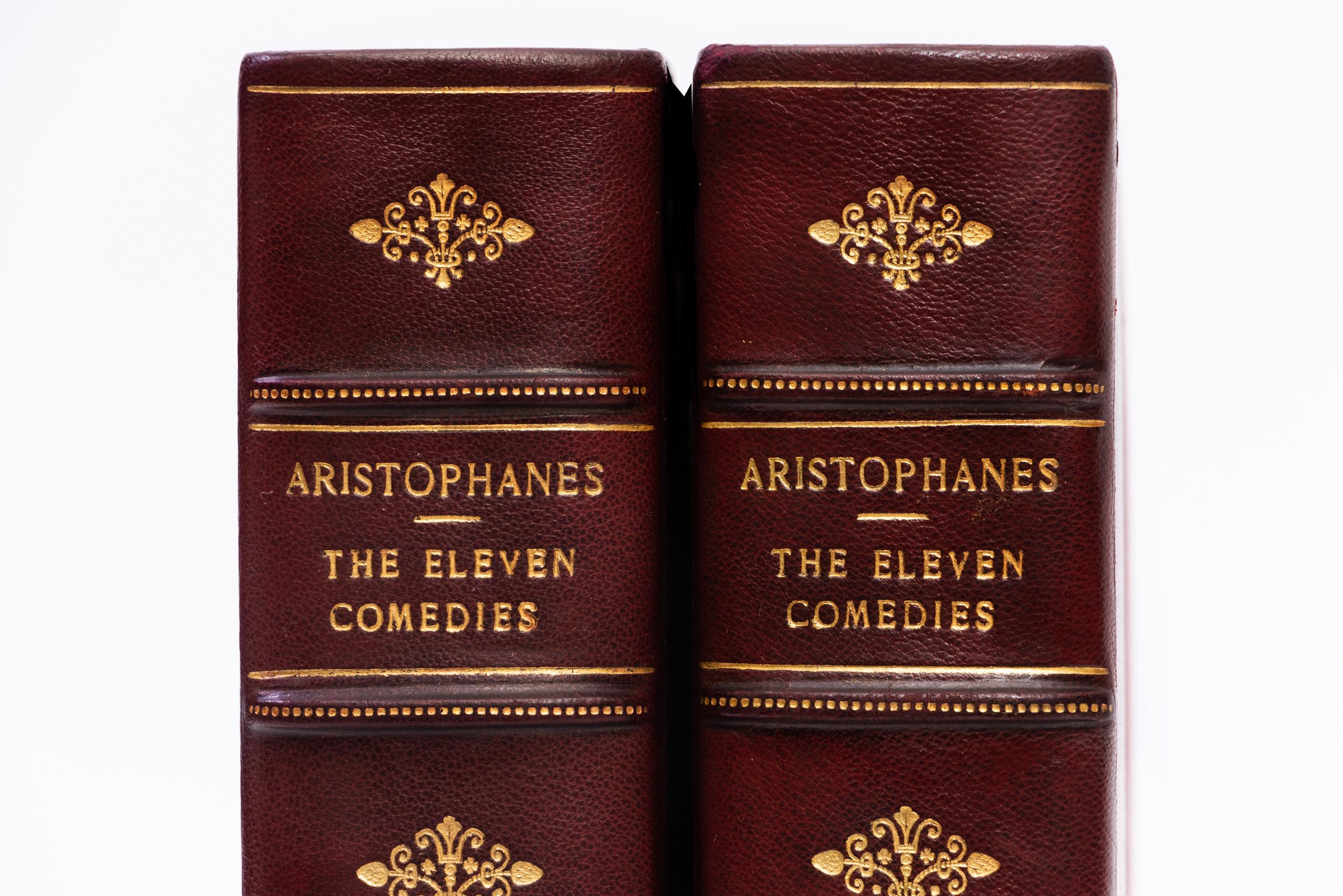 2 Volumes. Aristophanes, The Eleven Comedies. Bound in 3/4 red morocco. Linen boards. Raised bands. Decorative gilt emblems on spines. Top edges gilt. Decorative cork endpapers. This edition of the Eleven Comedies of Aristophanes is strictly limited