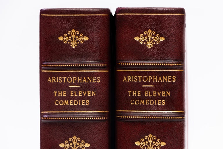 2 Volumes. Aristophanes, The Eleven Comedies. Bound in 3/4 red morocco. Linen boards. Raised bands. Decorative gilt emblems on spines. Top edges gilt. Decorative cork endpapers. This edition of the Eleven Comedies of Aristophanes is strictly limited