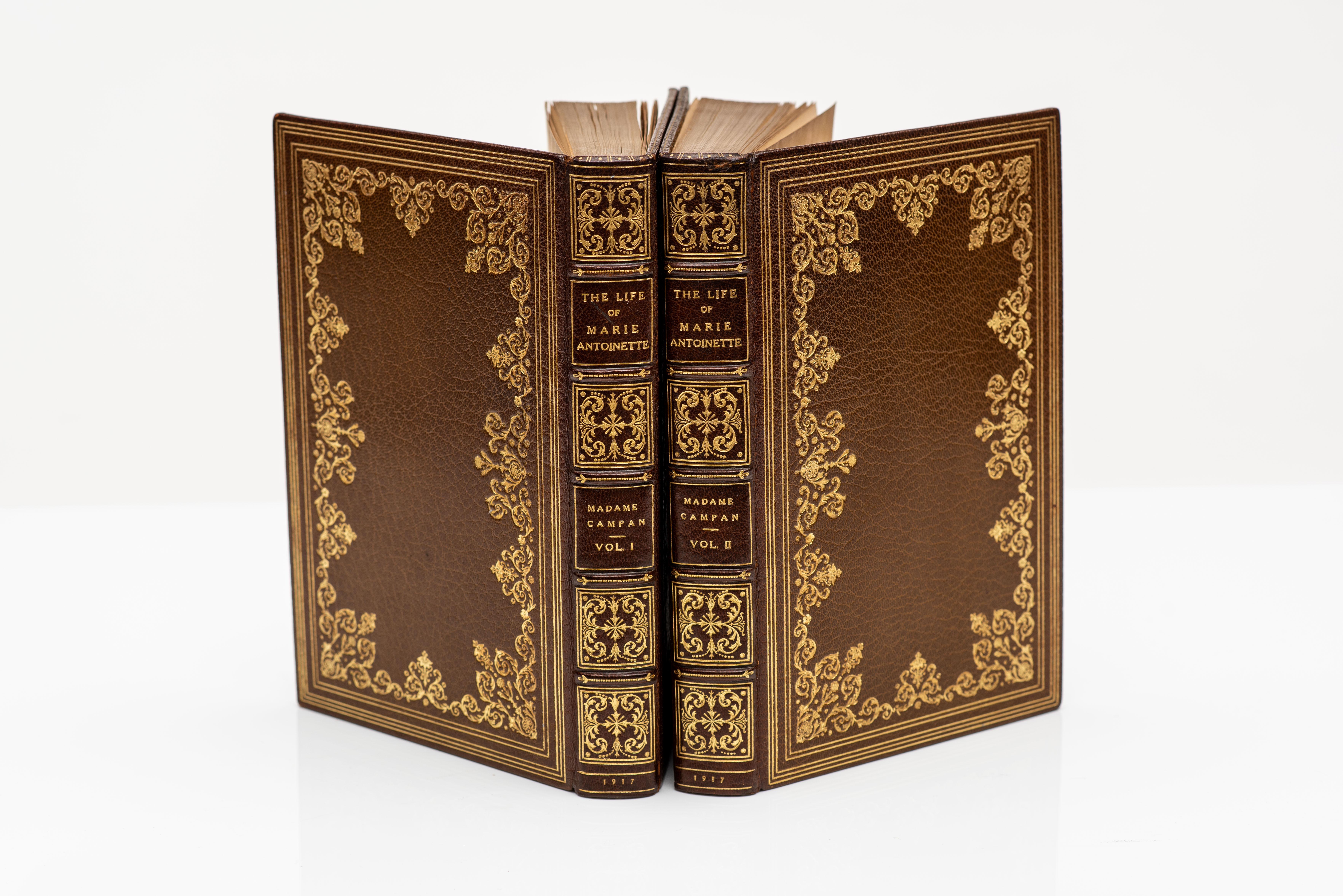 2 Volumes, Campan, Jeanne L.H. Memoirs Of The Private Life Of Marie Antoinette. With Illustrations. Bound in full orange morocco, ornate gilt on covers and spines, top edges gilt, raised bands, marbled endpapers. Published: New York: Brentanos: 1917.