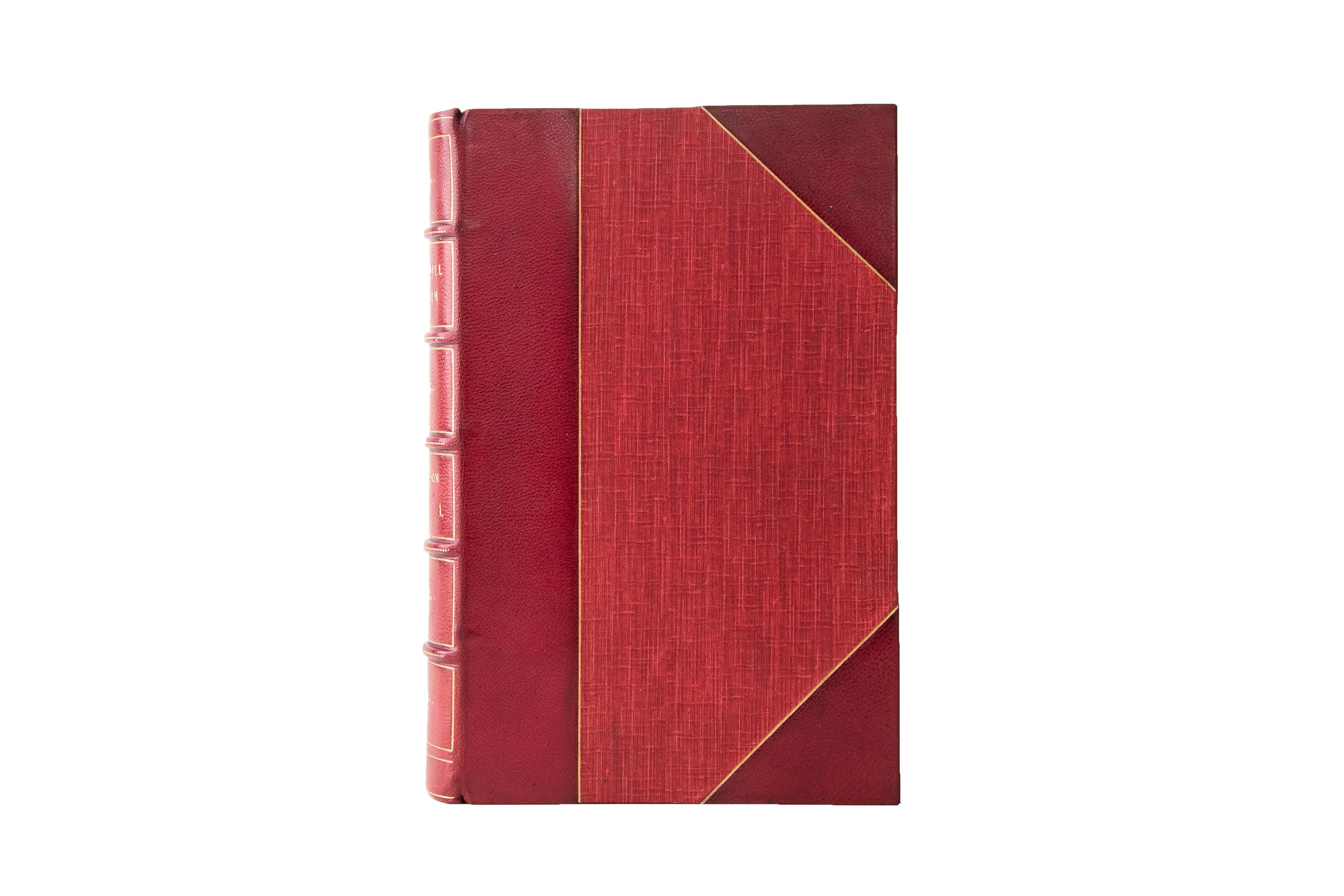 2 Volumes. George F.R. Henderson, Stonewall Jackson and the American Civil War. First Edition. Bound in 3/4 red morocco and linen boards, bordered in gilt-tooling. The spines display raised bands, label lettering, floral panel details, and