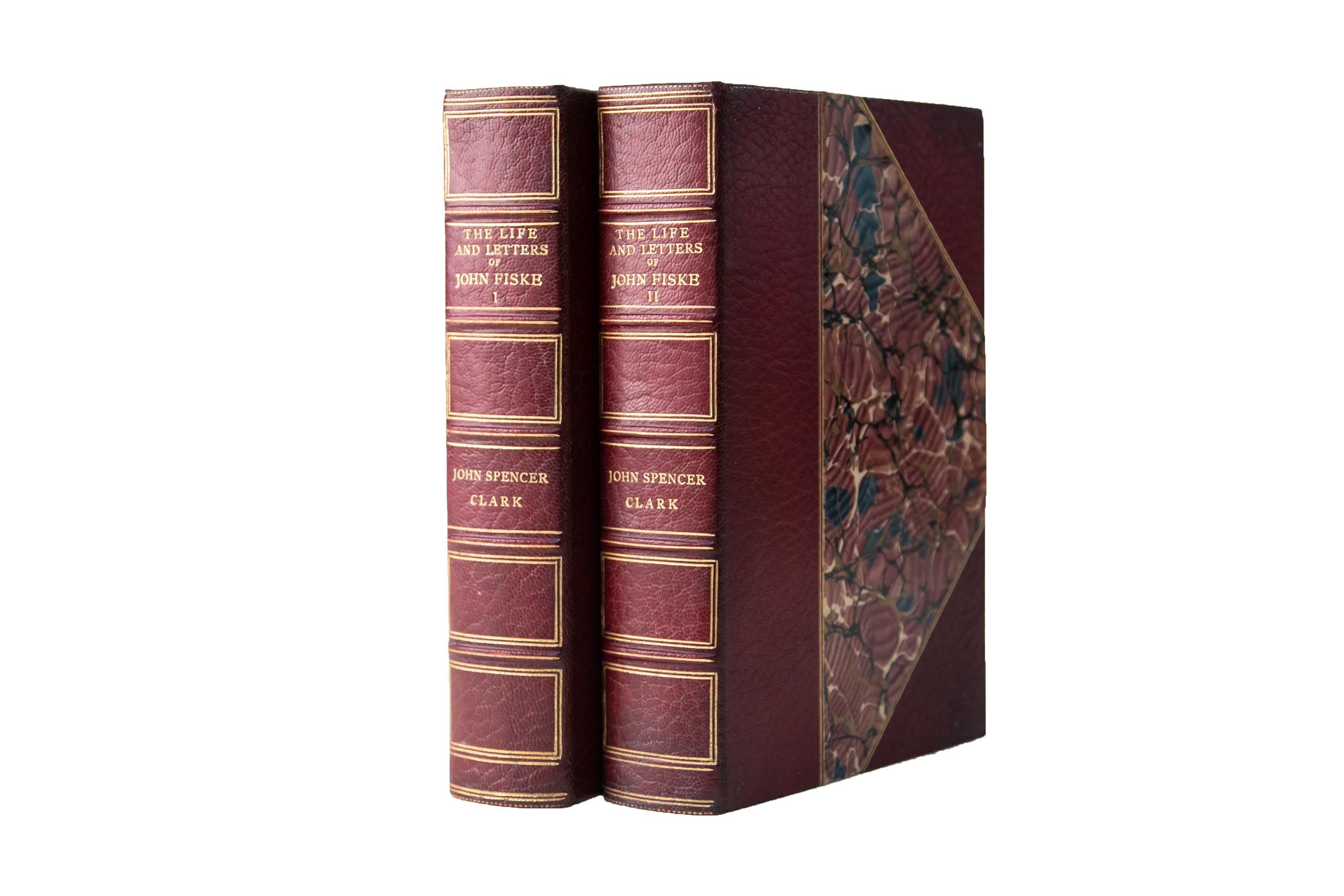 2 Volumes. John Fiske, The Life and Letters. Bound in 3/4 wine morocco and marbled boards, bordered in gilt-tooling. The spines display raised bands, bordering, and label lettering, all gilt-tooled. The top edges are gilded with marbled endpapers.