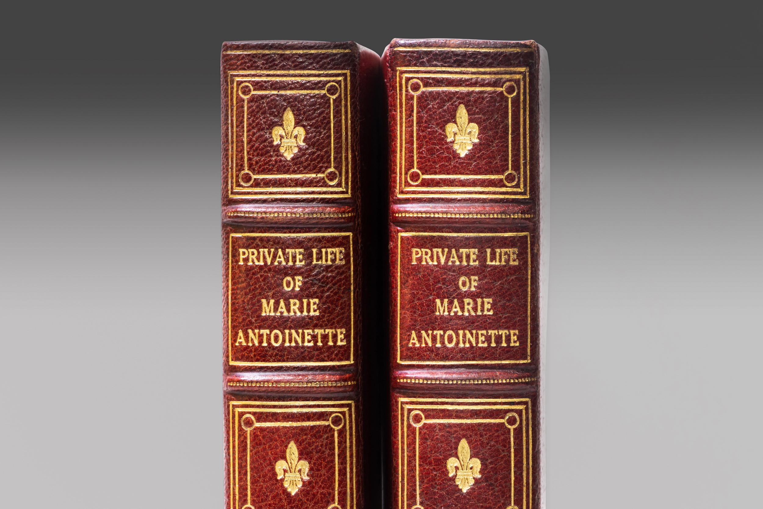2 Volumes. Madame Campan, The Private Life of Marie Antoinette. Bound in 3/4 red morocco. Linen boards. Raised bands. Decorative gilt symbols on spines. Top edges gilt. Cork endpapers. Illustrated. Published: New York; Brentano's 1917