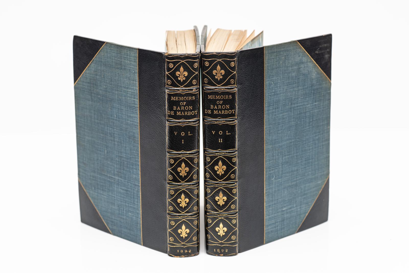 2 Volumes. Marcellin Marbot, The Memoirs of Baron de Marbot. Translated by Arthur John Butler. Bound in 3/4 blue morocco with linen boards. Gilt-tooling on covers and raised band spine. Top edges gilt. Marbled endpapers. Portrait frontispiece with