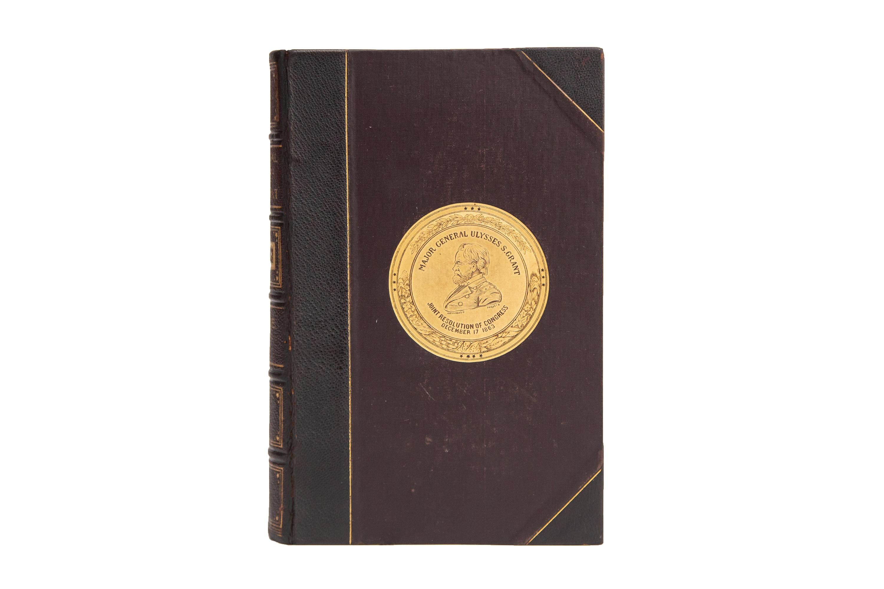 2 Volumes. U.S. Grant, Personal Memoirs. First Edition. Bound in 3/4 dark purple morocco and linen boards displaying an intricate gilt seal of Major General Ulysses S. Grant. Raised bands with panels displaying gilt Americana detailing and label