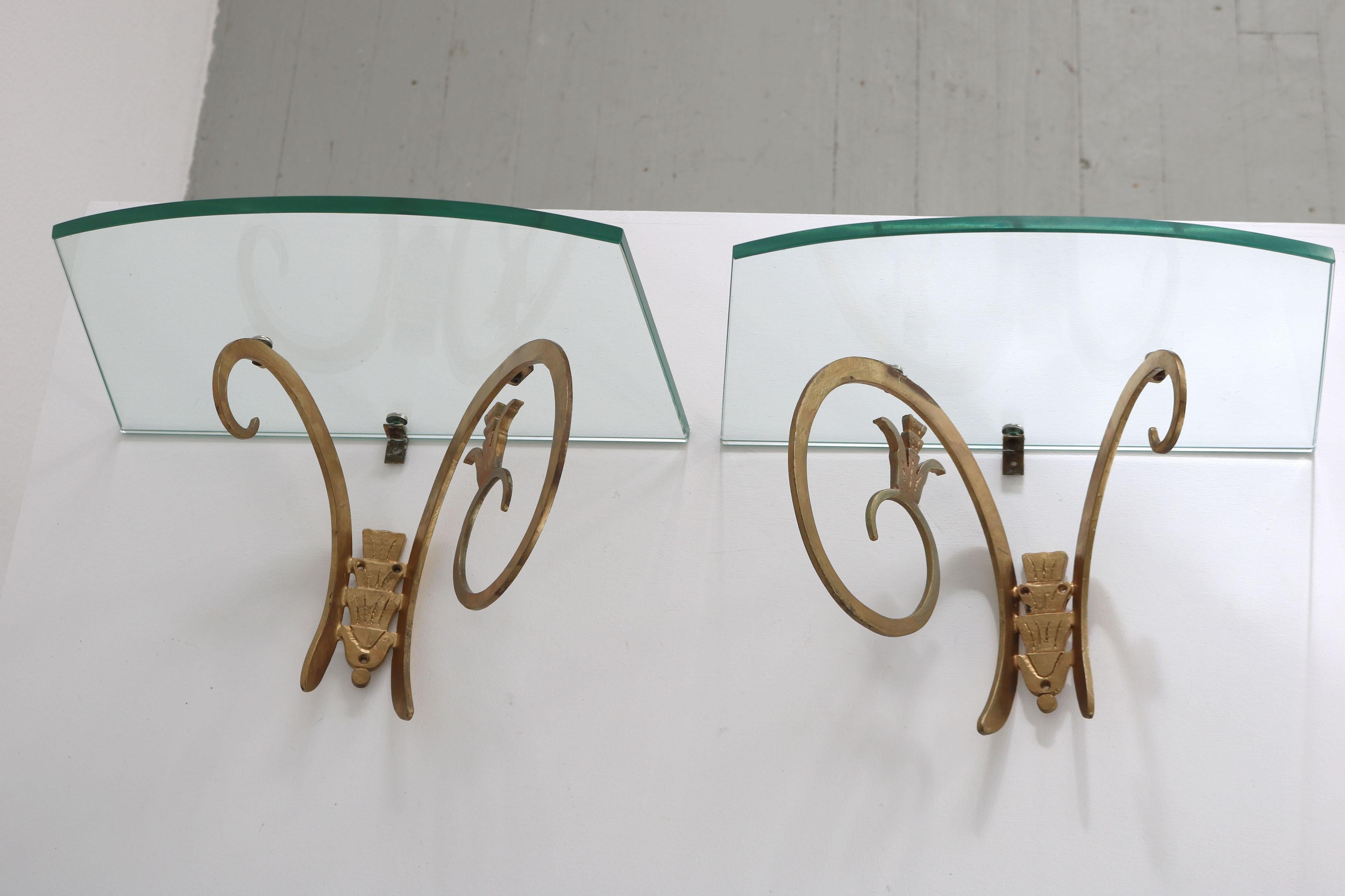 Mid-Century Modern 2 Wall consoles made of golden lacquered cast iron with glass shelf, Italy 1950s For Sale