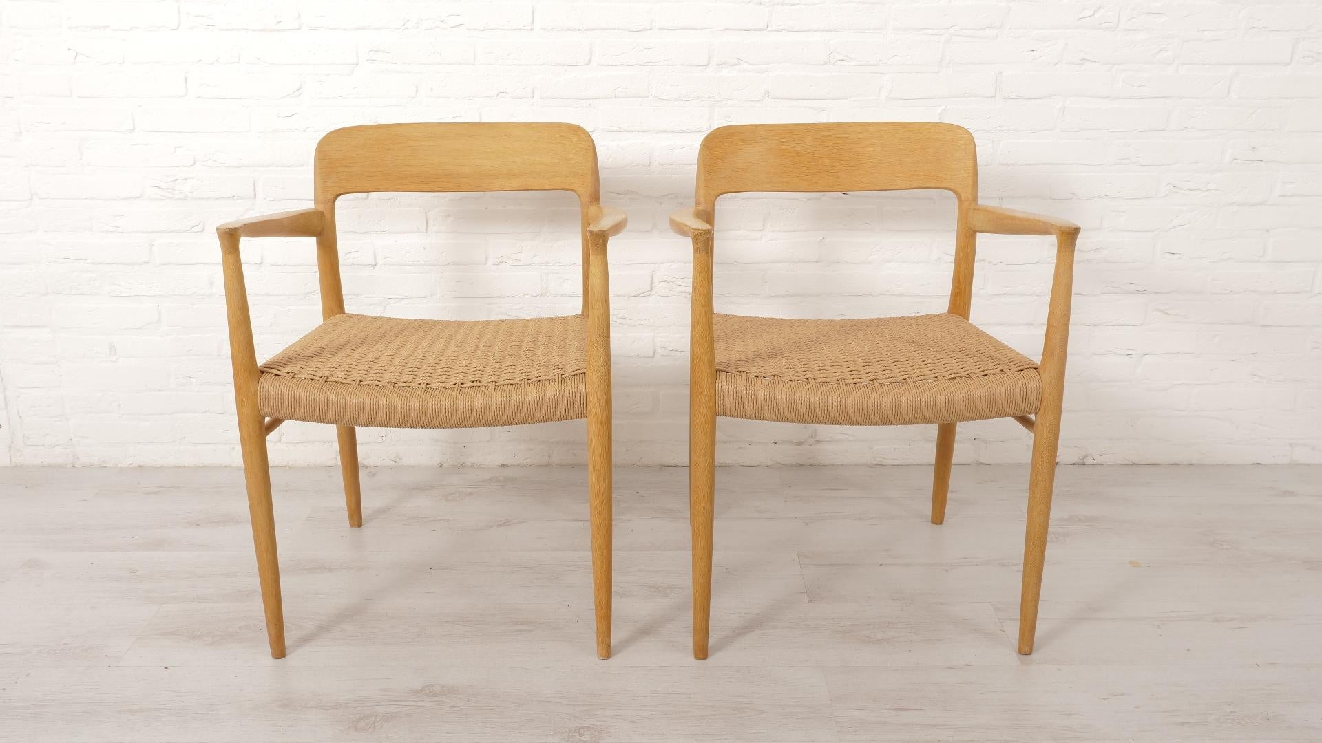 Set of 2 beautiful, exclusive vintage dining chairs. These chairs were designed by Niels Otto Møller, model 56. The chairs are finished in oak and fitted with new Danish Papercord. The frames of the chairs have been re-finished with Danish