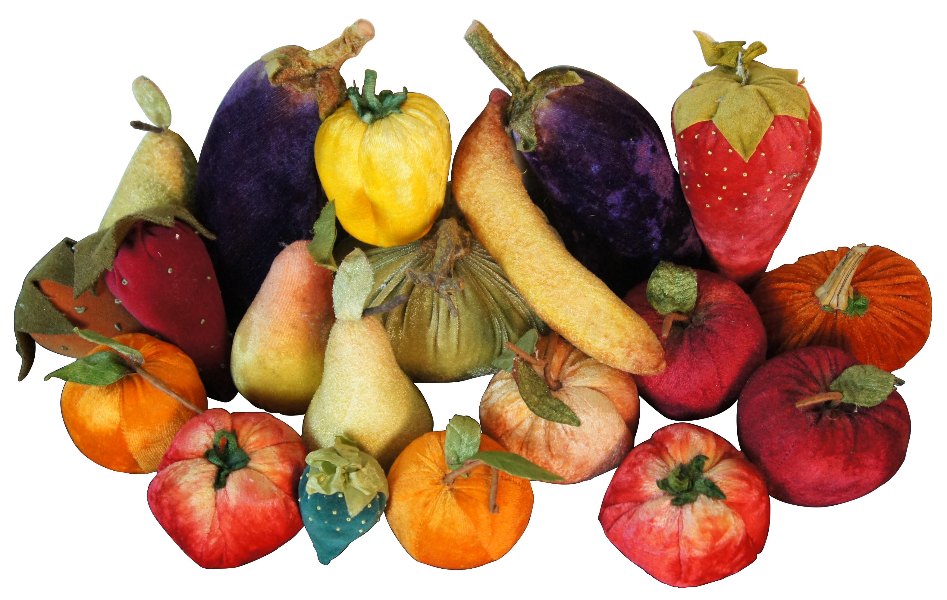 Lot of 20 pieces of velvet stuffed fruit and vegetables, including eggplant, strawberries, pears, apples, pumpkins, tomatoes, peaches/oranges, bell pepper and banana.

Largest (pumpkin) - 6” x 5.5” x 4.75” (width x depth x height).
 