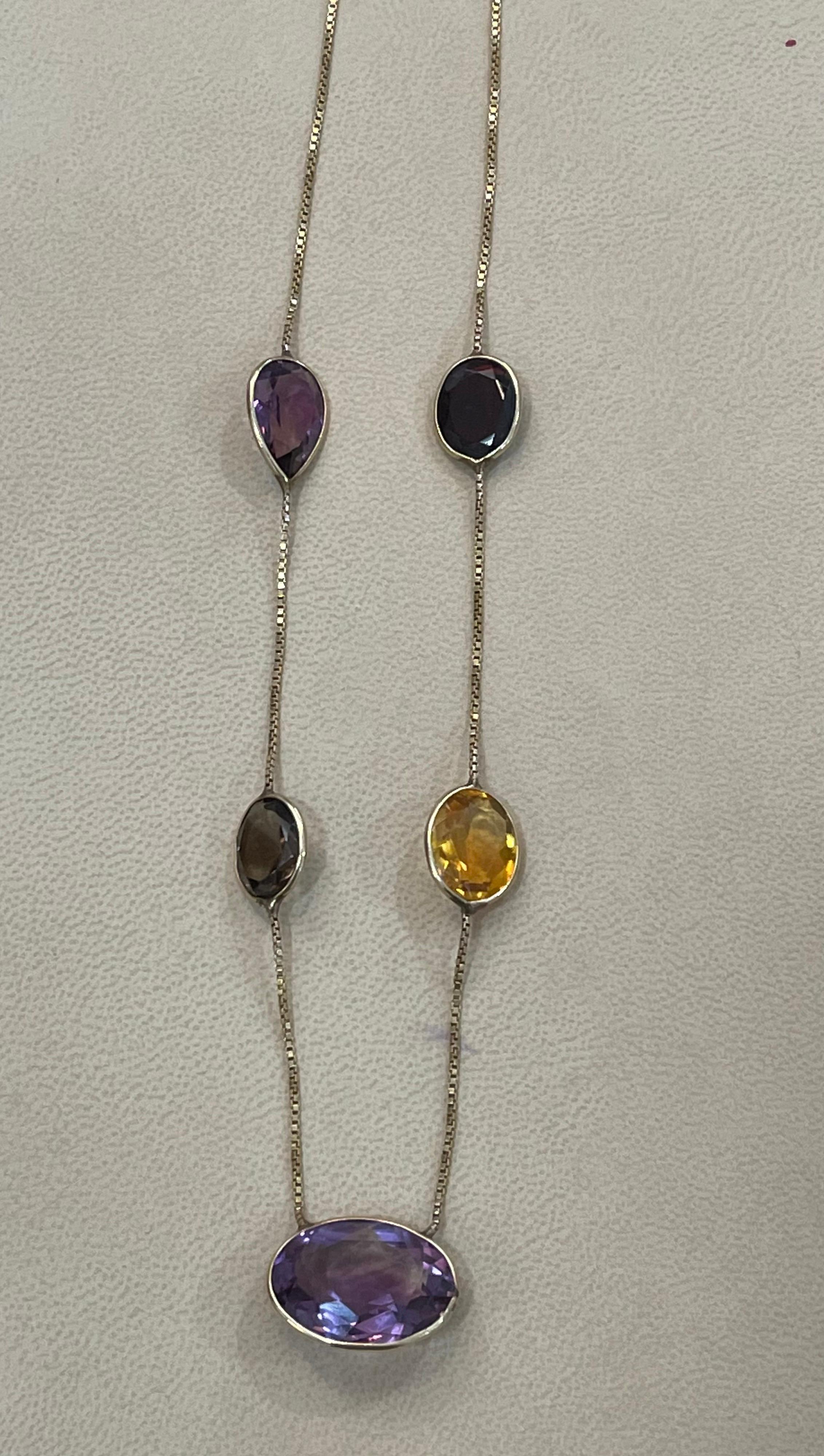 20 Carat Amethyst ,Citrine & Smoky Quartz 5 Piece  Chain Necklace 14 Karat Gold 17 Inch
14 K White Gold 
This Simple Necklace is consist  of  Fine   Semi Precious stones ,5 pieces.
 Natural  Amethyst , Smoky Quartz and citrine 
In the Center there