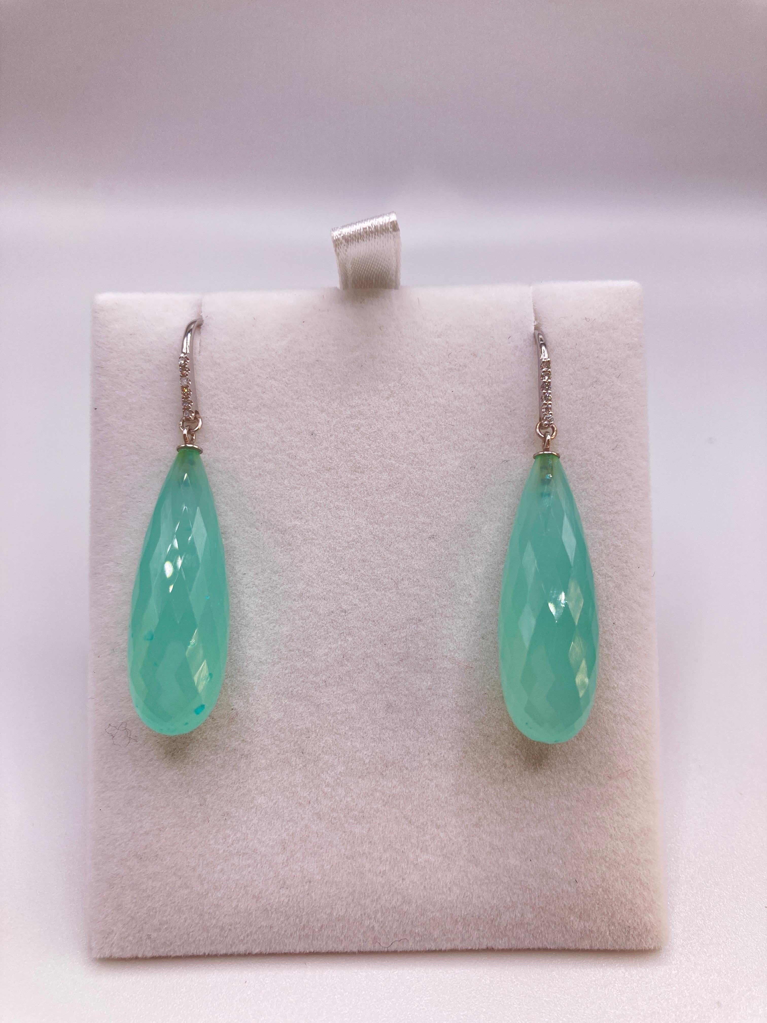 These lovely faceted 20 carat each Chalcedony perfectly math color wise and are not too heavy on the ear lobe at 4.4 grams. The 14kt white gold and diamonds set make it more evening but can also be worn casually.