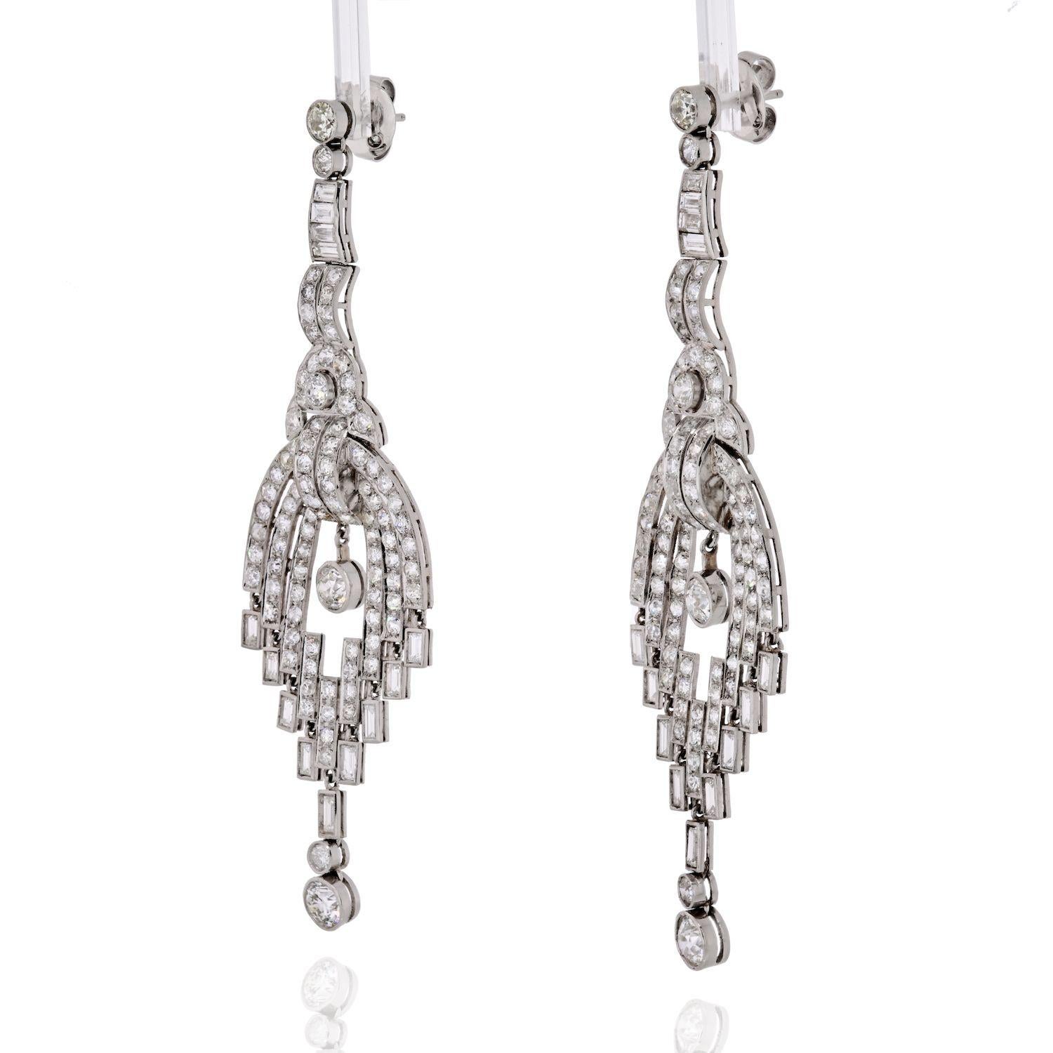 Indulge in the timeless elegance of these exquisite estate diamond chandelier earrings, a true epitome of glamour and sophistication. Crafted in lustrous platinum, these captivating earrings dangle gracefully, catching the light with every movement.