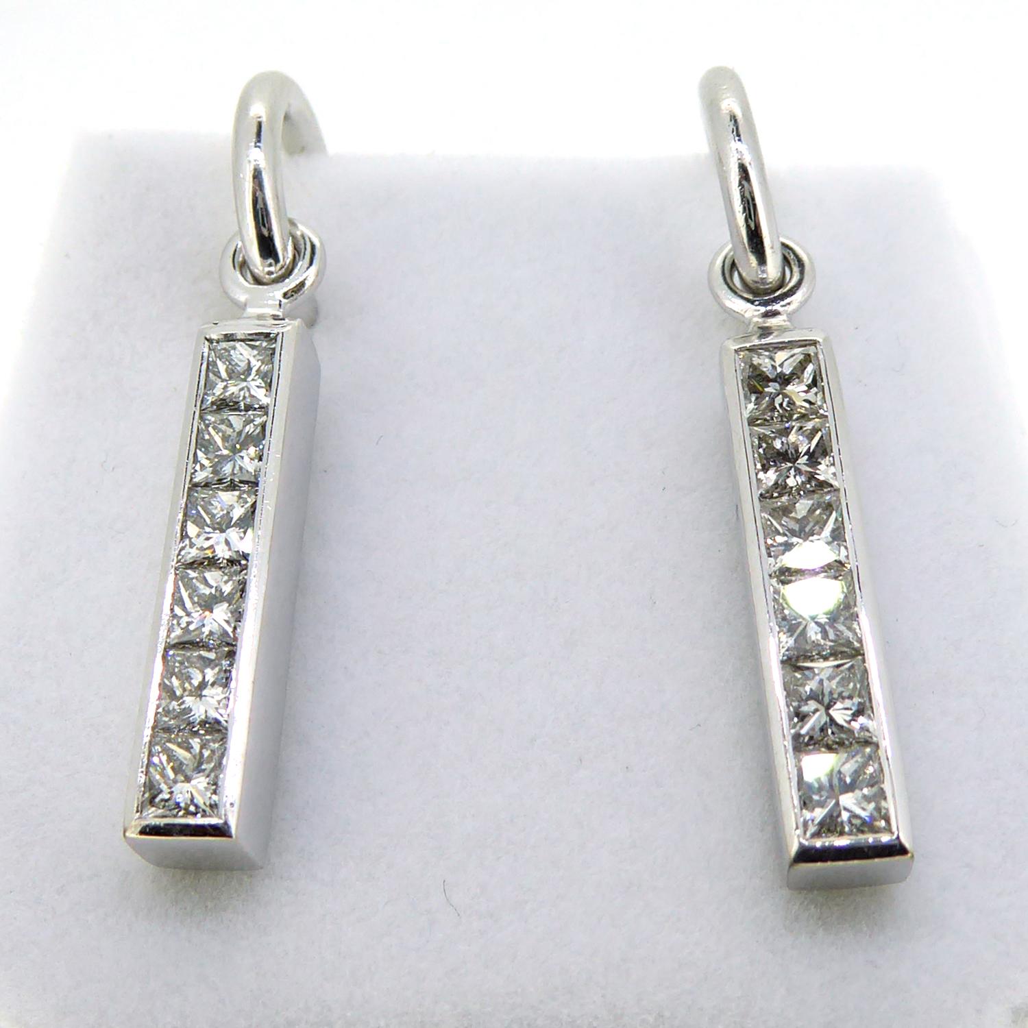Marvellous contemporary diamond drop earrings set with a total of 2.0ct of brilliant cut stones.  Designed by the renowned British designer, Theo Fennell, these earrings are from a previous range known as Strip!  Each earring comprises a