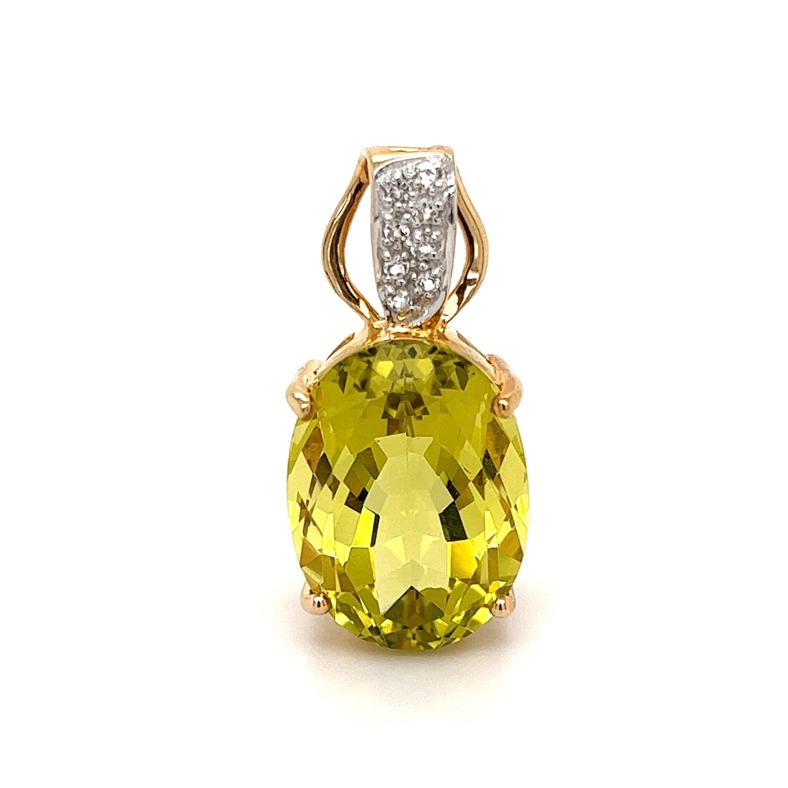 Simply Beautiful! Finely detailed Oval Lemon Citrine Gold Pendant. Securely Hand set with an Oval Lemon Citrine weighing approx. 20 Carat and bale set with White Topaz, approx. 0.18tcw. Measuring approx. 1.25” L. x 0.60” W x 0.50” D. Hand crafted