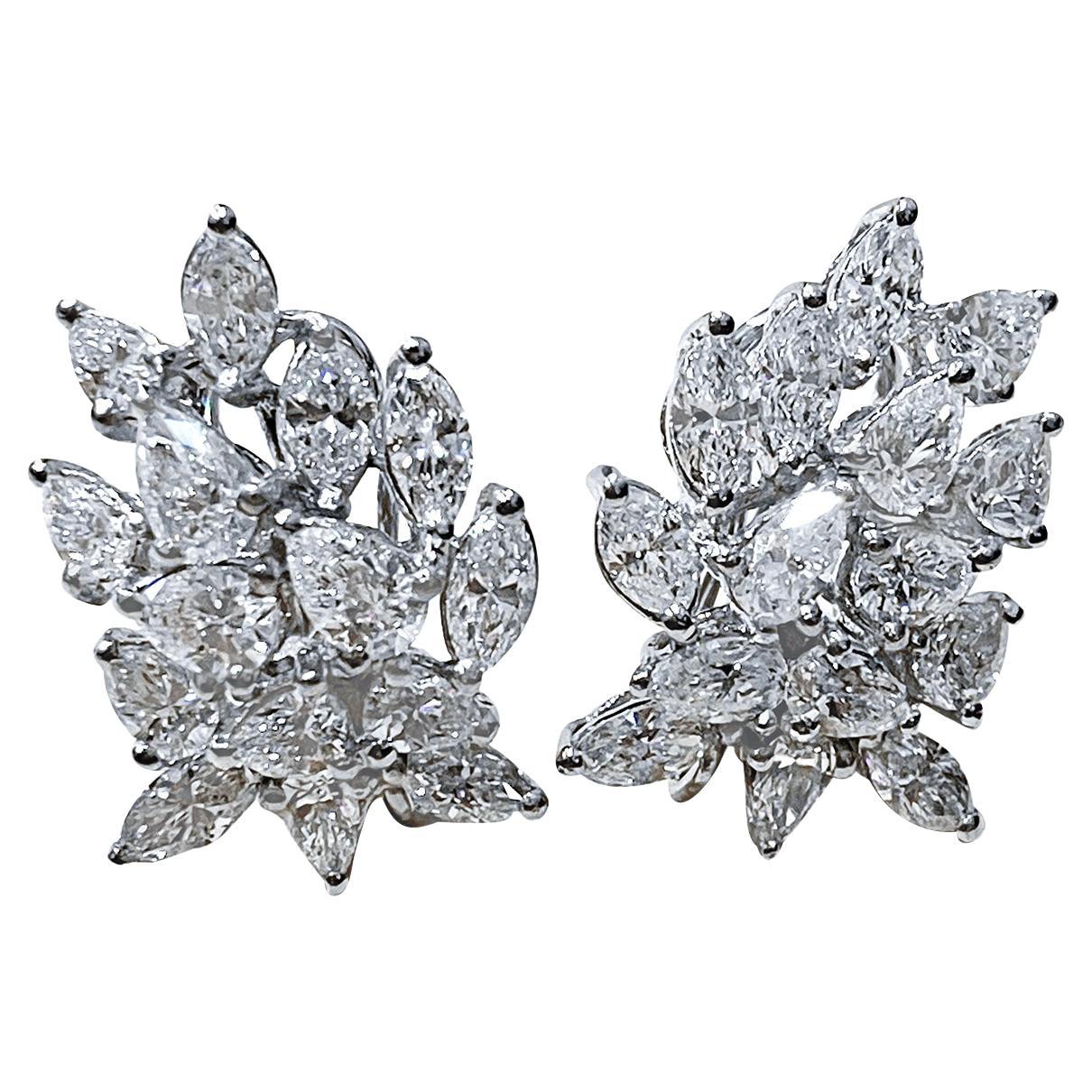 1960's Platinum And Diamond earrings 
weight of platinum 24.6 Gm
15  diamonds in each earring 
Total 30 diamonds.
There are Marquise shape diamonds and Pear shape diamonds.
 Total weight of the d1amonds is approximately weight 20 Ct

total weight of