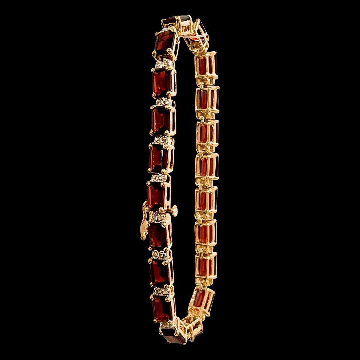  Approximately 20 Carat Natural Emerald cut Garnet & Diamond Tennis Bracelet 14 Karat Yellow Gold .
 This exceptionally affordable Tennis  bracelet has 20  stones of emerald cut   Garnet . Each Garnet is separated by two tony diamonds . Total weight