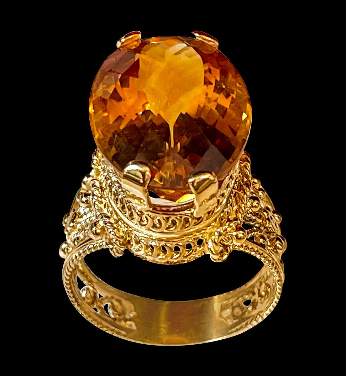 Approximately 20 Carat Natural  Long Oval  Checkerboard  Citrine Cocktail  Ring in 14 Karat Yellow Gold, Estate size 12
This is a ring which has a  approximately 20-22  carat of high quality Citrine stone. The stone is 25X17 MM and  12  mm