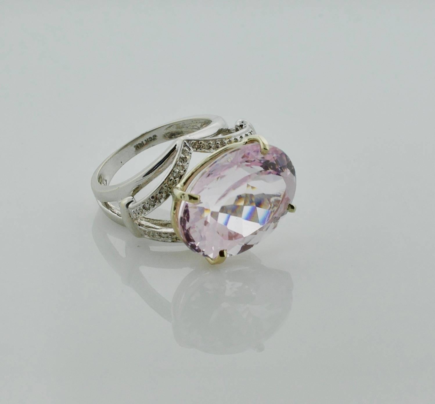 20 carat Oval Kunzite and Diamond Ring in White Gold
Featuring a 20 carat (approximately)
Thirty Six Round Cut Diamonds weighing .20 carats approximately
Currently size 9.  We will size it free of charge.
Lots of Fun with This Large Stone Ring 