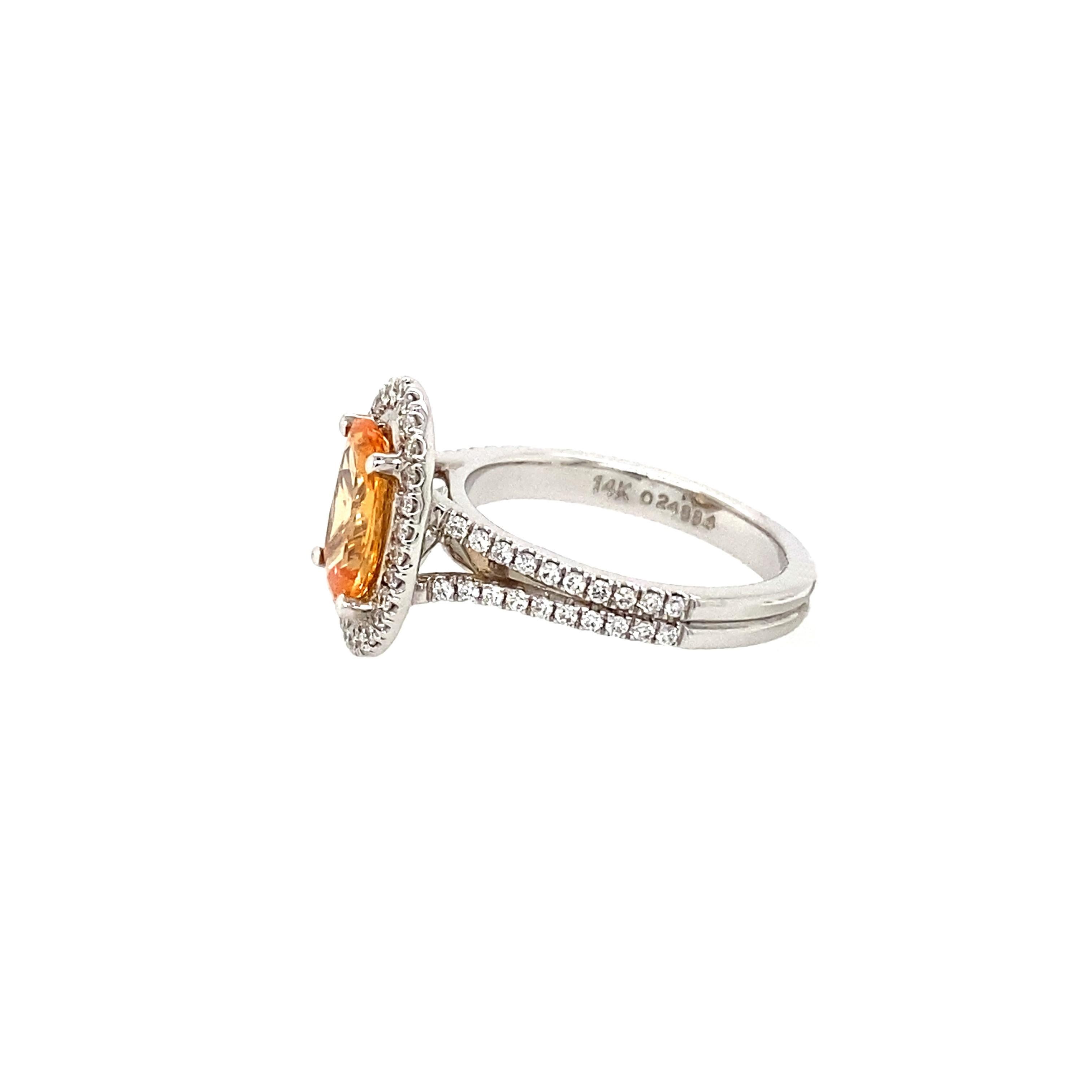 2.0 Carat Oval Madagascar Sapphire ring set in a Halo of Diamonds with a Split Shank. 

68 round Brilliant Diamonds .41 Carat Total Weight H-I/I1  

Madagascar Orange sapphires are quite unusual. This Fashionable ring can be worn any time of the