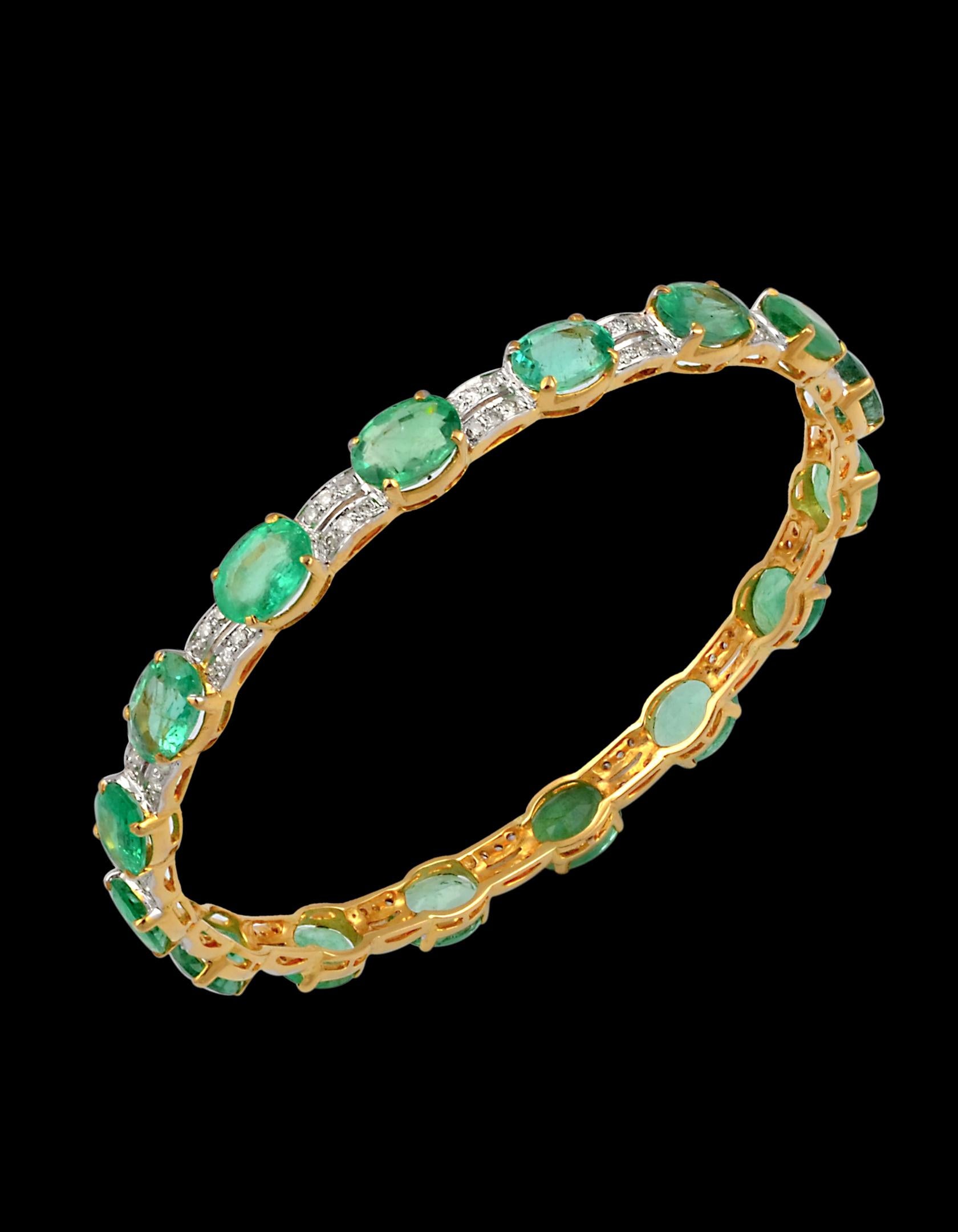  20 Carat Oval Natural Emeralds & Diamonds 18 Karat Yellow Gold 17 Grams Bangle 
It features a bangle crafted with  18 karat Yellow gold and  Round brilliant  cut diamonds 
Emeralds  16 pieces , each  6 X 8 MM approximately 1.25 ct each , total