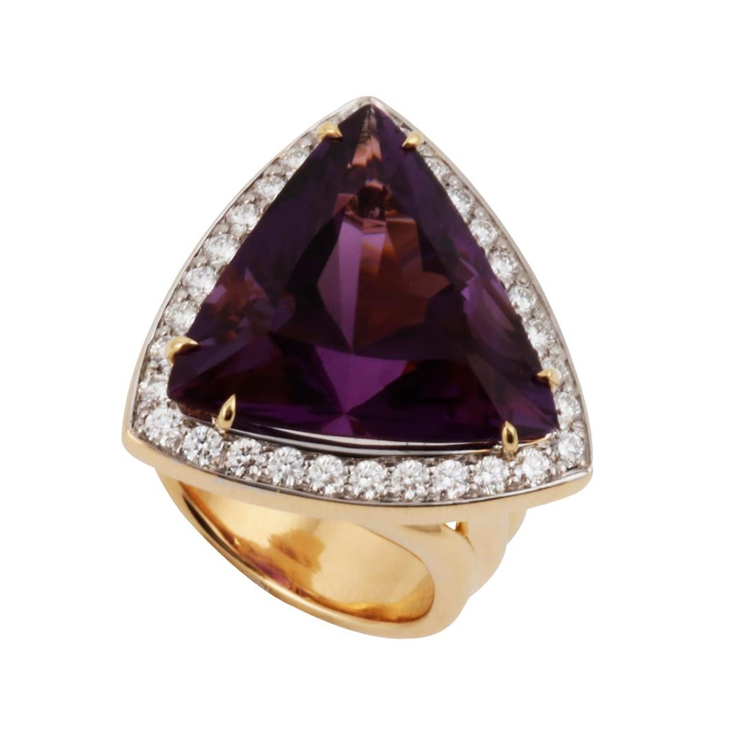 Thirty round brilliant cut diamonds are DEF color and VS1 clarity and weigh 1.01 carats.  I created the 18k ring specifically for this large amethyst in an unusual cut. It comes in a unique custom made box designed by Prince John Landrum
