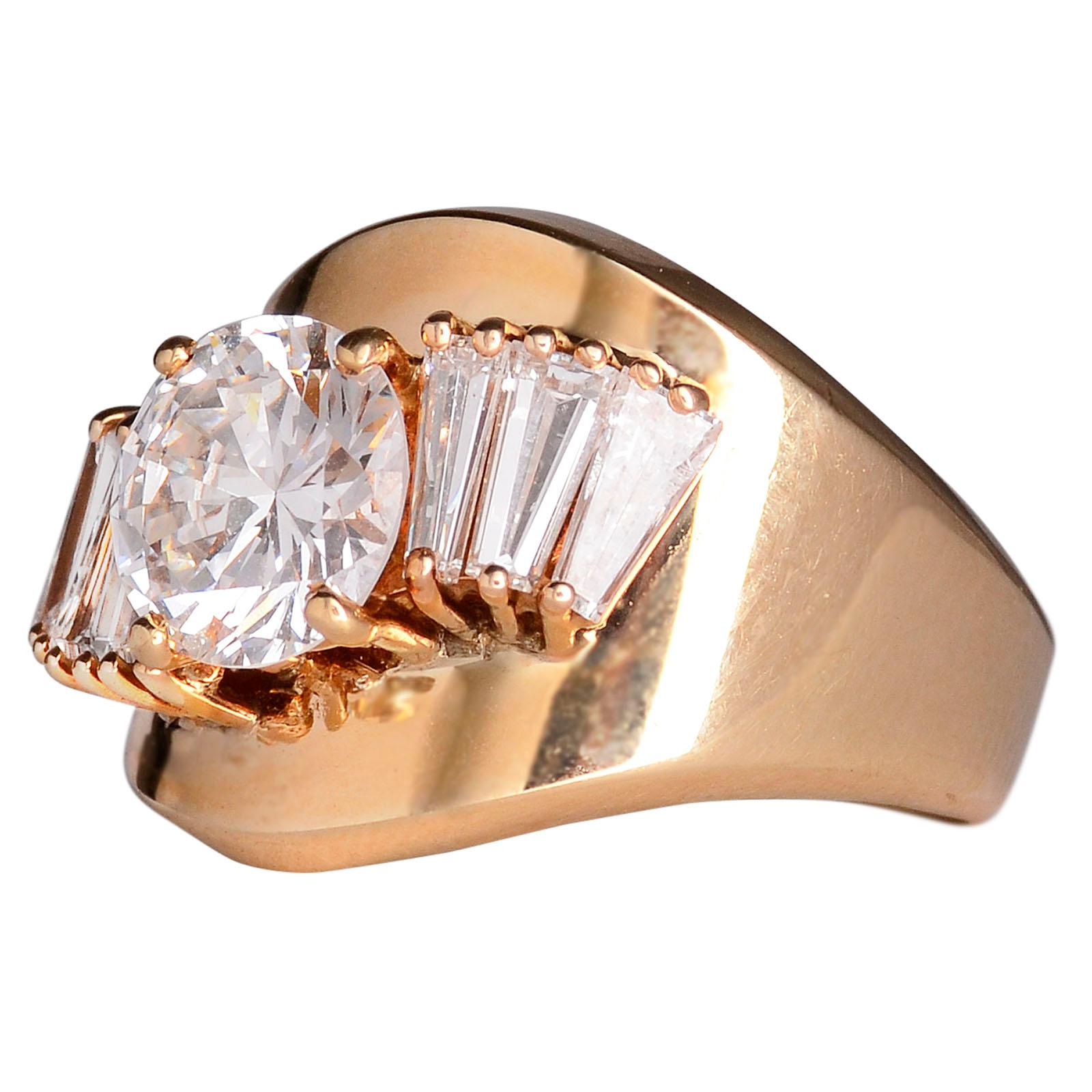 Estate 2.0 carat VS center diamond ring. This 14 karat yellow gold ring has a 2.0 carat center diamond with VS2 clarity and G color. The estate diamond ring is accented with six tapered baguette diamonds at 1.80 carat total weight with VS1-2 clarity
