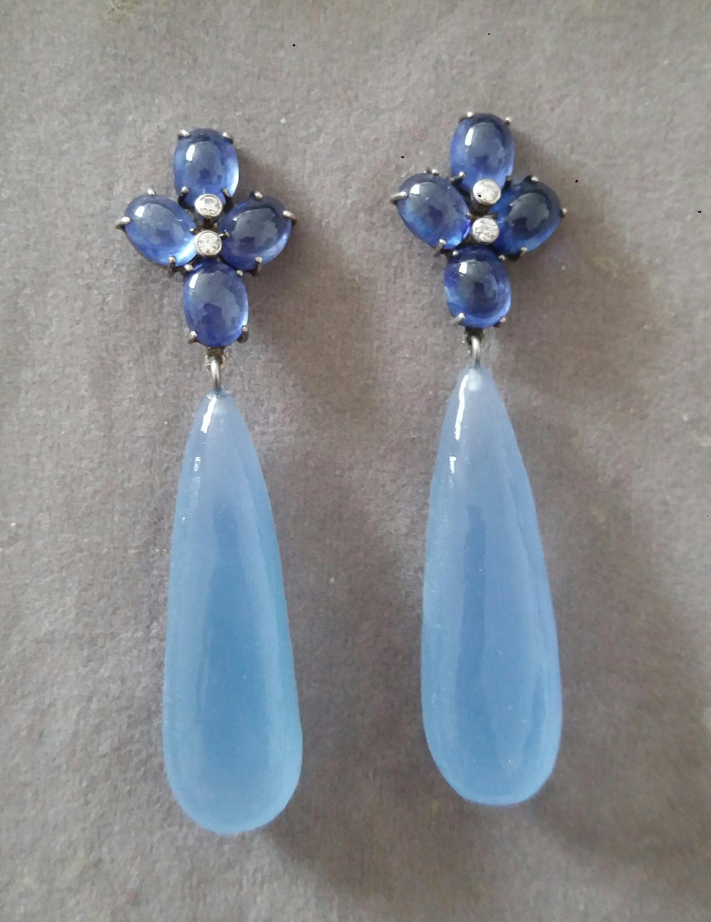Elegant and completely handmade Earrings consisting of an upper part of 4 oval shape Blue Sapphires 6x8 mm  and weighing 20 Carats set together in 14 Kt white gold with 2 small diamonds in the center, at the bottom we have 2 Pear Shape Chalcedony