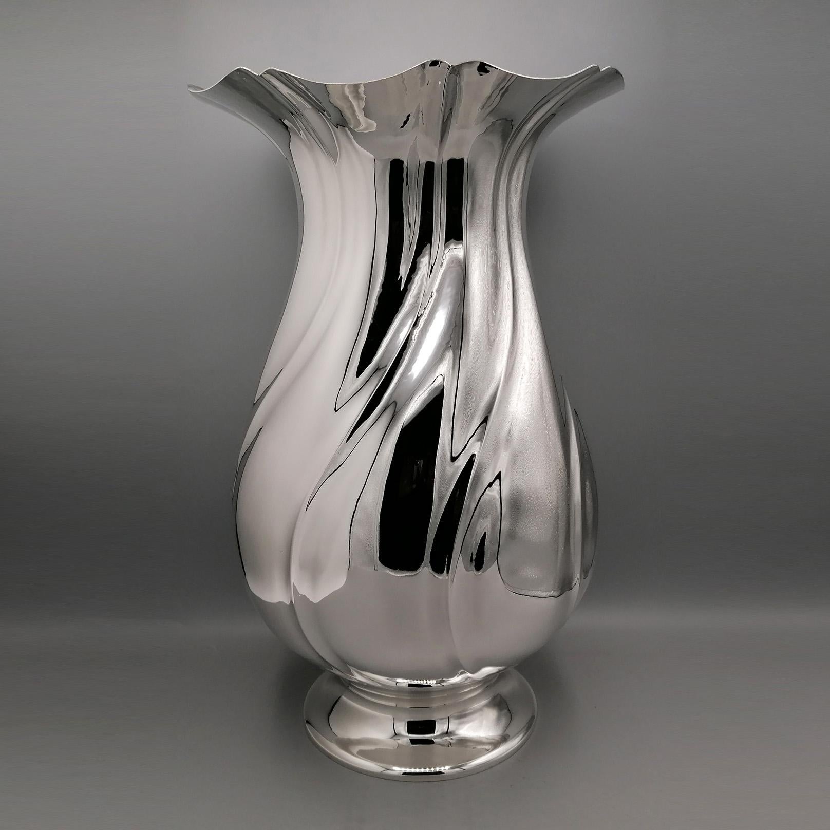 Impressive solid 800 silver vase.
The pot-bellied body was embossed and chiseled with a torchon motif, creating a notable brightness and brilliance to the vase.
The mouth of the vase is very wide, suitable for holding long-stemmed flowers.
The base,