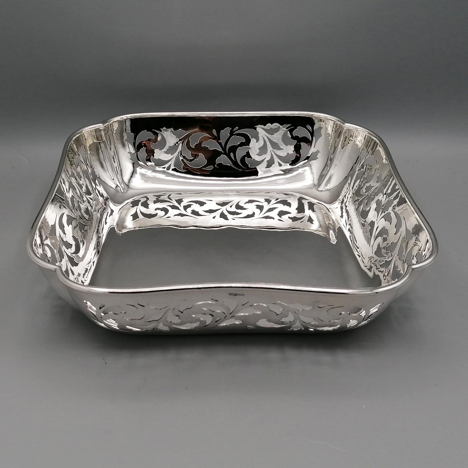 Handmade and Pierced Sterling Silver Centerpiece.
Impressive bowl, handcrafted in Milan - Italy in the artisan workshop of the silversmith Roberto Malagola.
The shape of the body is modelled, edged and subsequently hand-pierced with florwers