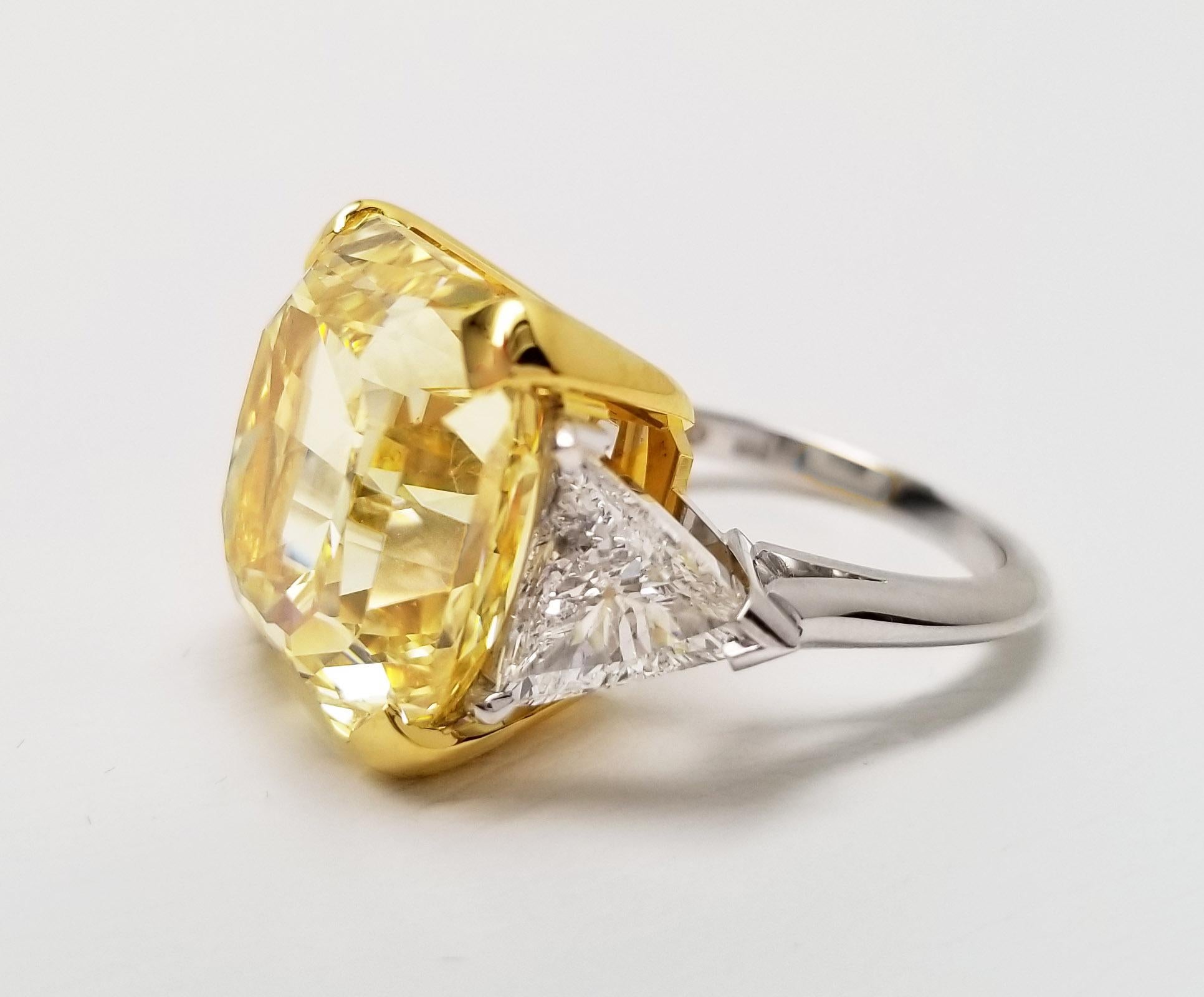 A GIA certified, internally flawless intense yellow diamond with excellent symmetry and no fluorescence from Scarselli. Set between two trilliant cut white diamond side stones on a white gold band.

Bigger is better – perfectly exemplified in this