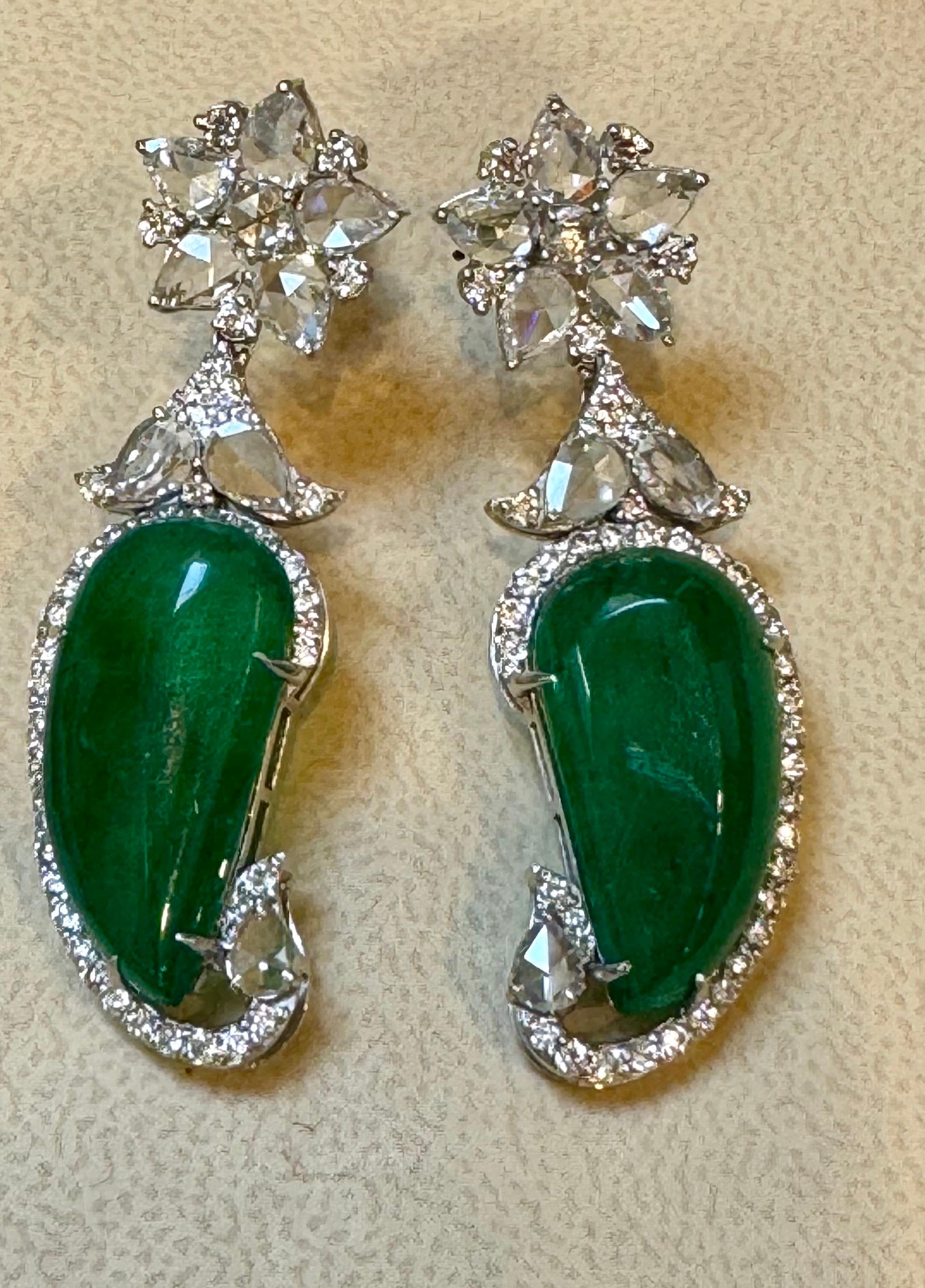20 Ct Fine Emerald Cabochon & 4 Ct Rose Cut Diamond  18 Kt White Gold  Earrings
Emerald Diamond Post Earrings 18 Karat White Gold
Two fine  leaf emerald Cabochon of total 20  ct exact known weight. Emeralds are surrounded by Brilliant cut round