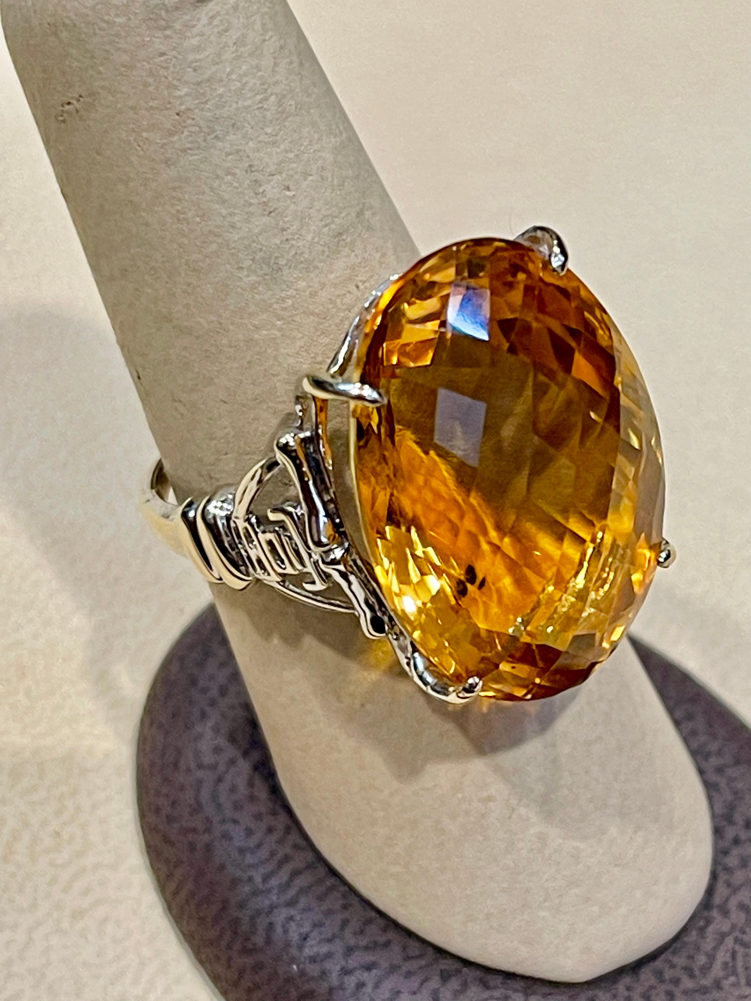 Exact 34.41 Carat Natural  Long Oval  Checkerboard  Citrine Cocktail  Ring in 14 Karat Yellow Gold, Estate 
This is a ring which has a  approximately 20 carat of high quality Citrine stone. The stone is 25X17 MM and  12  mm Deep
Color and clarity is