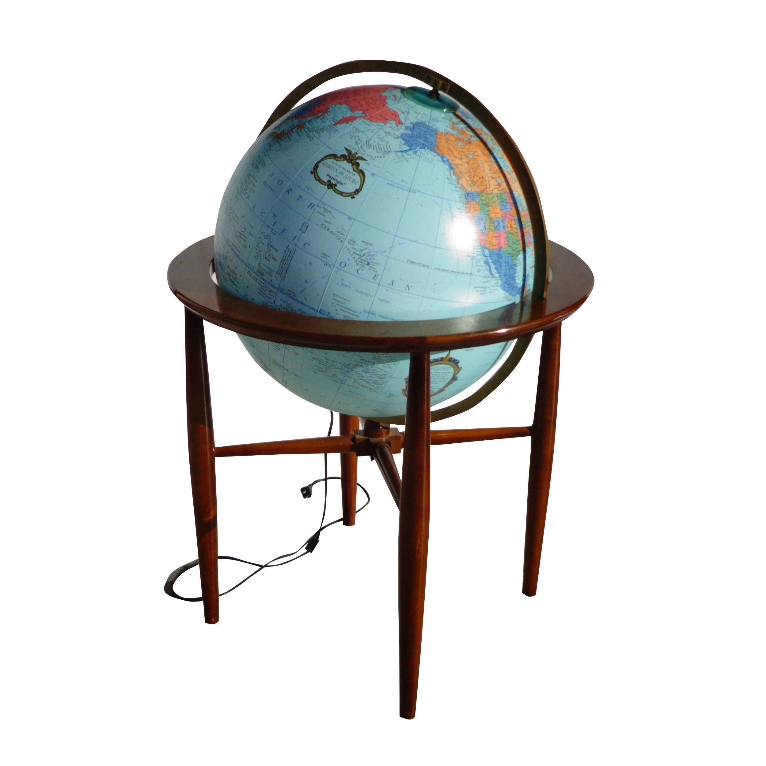 1970s Replogle Illuminated glass globe on a dark brown walnut stand.
Globe has a full 360 degree turning function. Working condition and has a switch in between the cord.
Marked at the Globe. Measure: 20″.

 
