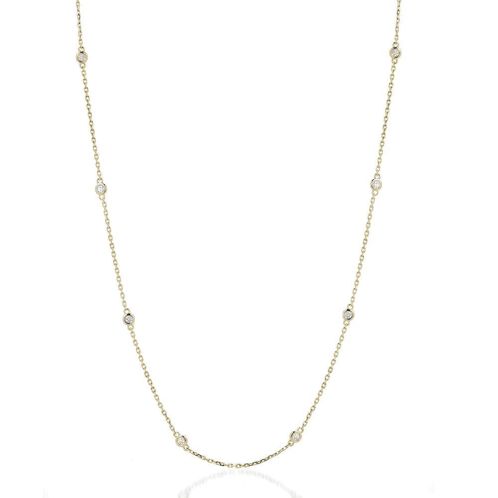 Eight elegant round diamonds set in a bezel setting along a 14k gold chain necklace.

Gold: 14K Gold
Number of Diamonds: Eight
Gold Color: Yellow Gold
Carat: 1 Carat
Necklace Length: 20 Inches
Diamond Clarity: VS
Diamond Color: F
Chain Type: