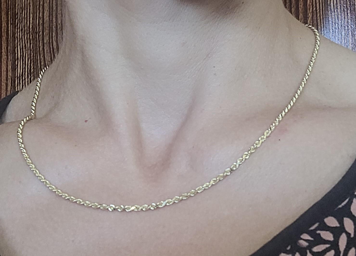 Beautiful 14kt yellow gold 20-inch rope chain that is 2.2mm wide, secured with a lobster clasp, weighs 10 grams, and stamped BBB and 14k confirming its gold authenticity. BBB stands for British Bullion Brokers, this hallmark confirms gold quality