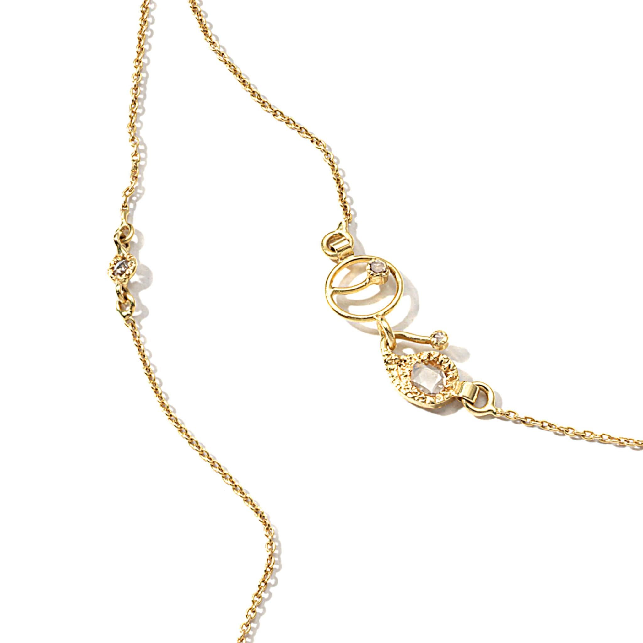 Chain necklace set in 20K yellow gold with 0.52cts diamond stations and paisley clasp detail, length measures 24 inches.
